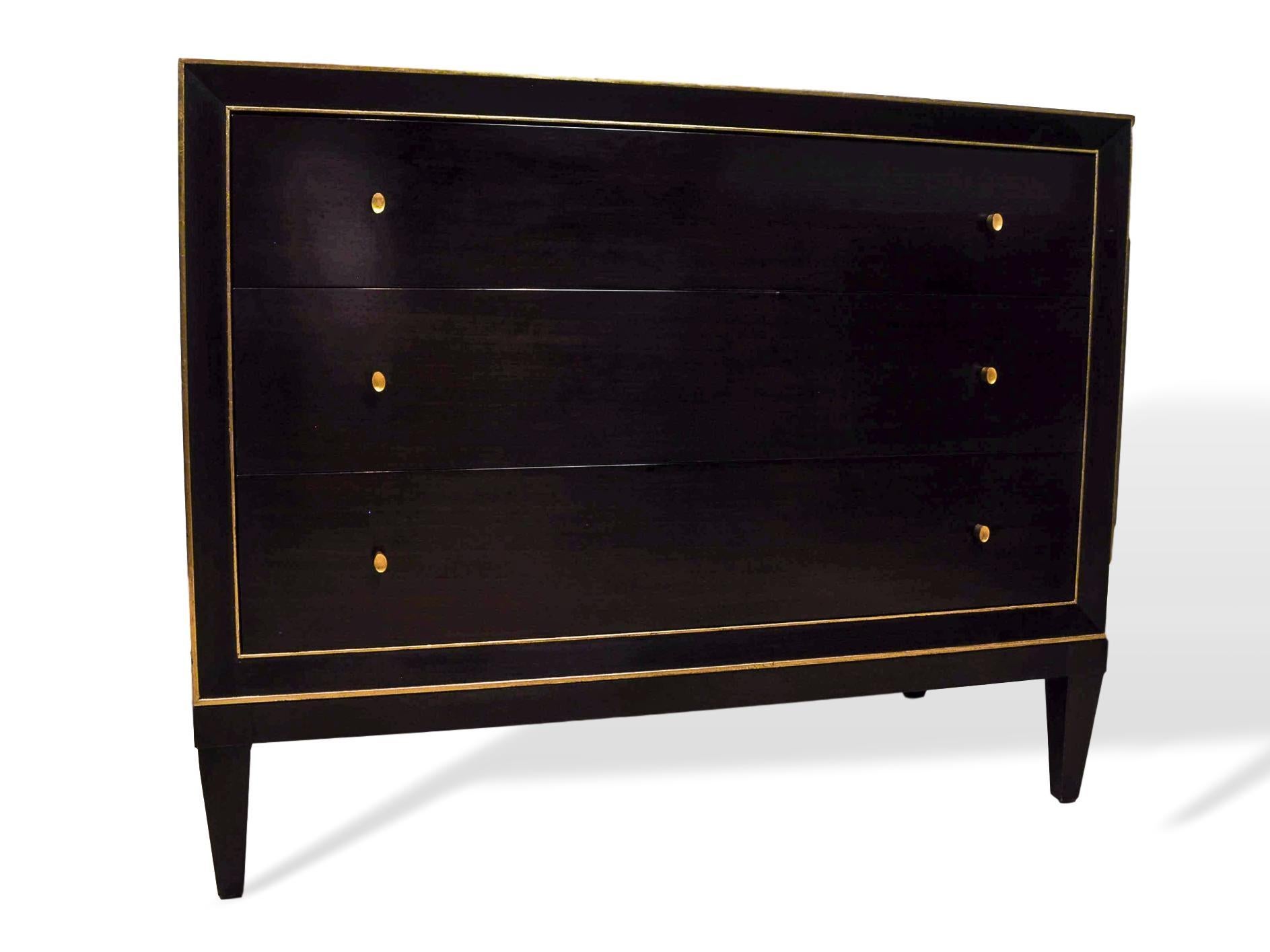 Barbara Barry for Baker furniture ebonized mahogany three-drawer commode, with gilded bandings, gold finished pulls, with soft-close drawers; signed with metal plates to interior top drawer, for Baker Furniture and another for The Barbara Barry