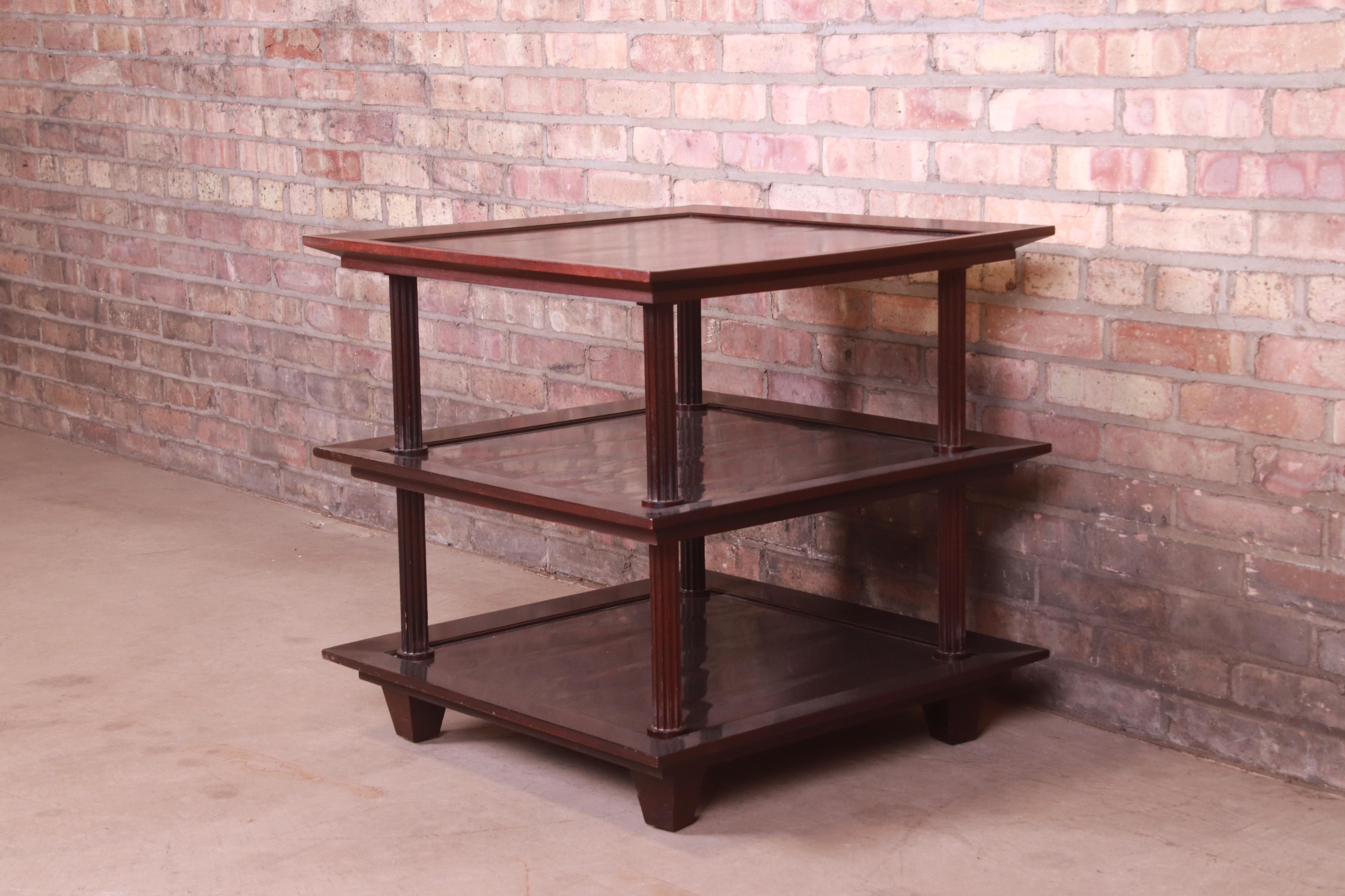 An exceptional contemporary three-tier dark mahogany occasional side table

By Barbara Barry for Baker Furniture

USA, Circa 1990s

Measures: 26