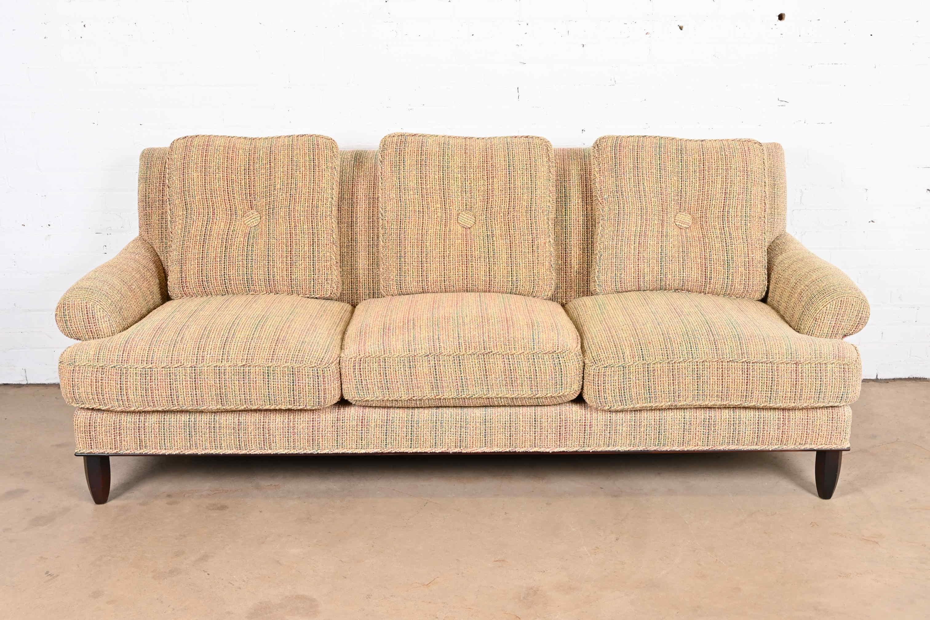 An outstanding contemporary custom upholstered down-filled sofa

By Barbara Barry for Baker Furniture

USA, Circa 1990s

Fully upholstered in original textured fabric, with down filled cushions and mahogany feet.

Measures: 88.75