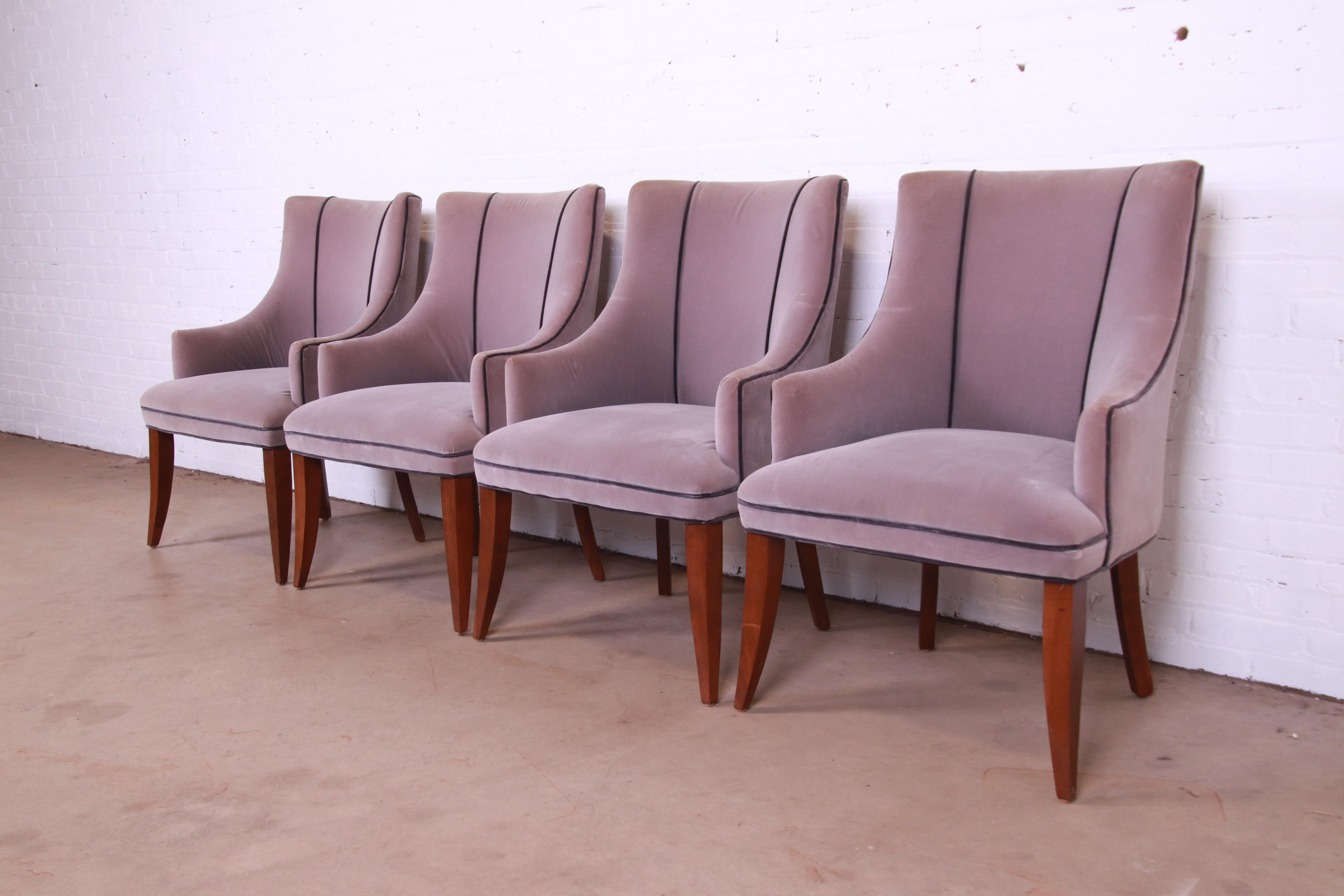 A gorgeous set of four Modern Art Deco style upholstered club chairs or dining armchairs

By Barbara Barry for Baker Furniture

USA, Circa 1990s

Lavender upholstery, with mahogany saber legs.

Measures: 26.5