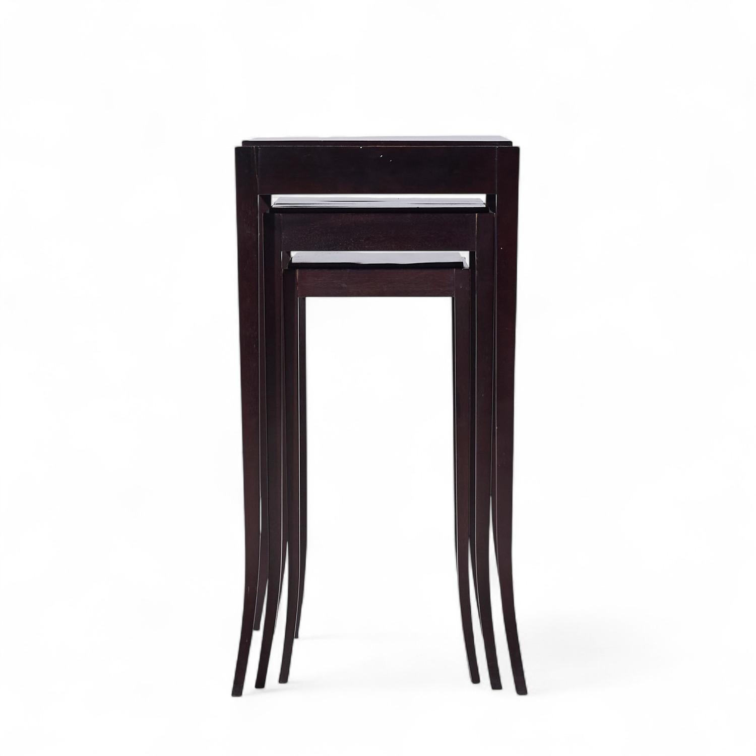 Barbara Barry for Baker Mahogany Nesting Tables - Set of 3

The top table measures: 14.5 wide x 14.5 deep x 28.75 inches high
The middle table measures: 12.25 wide x 14.5 deep x 25.25 inches high
The bottom table measures: 10 wide x 14.5 deep x