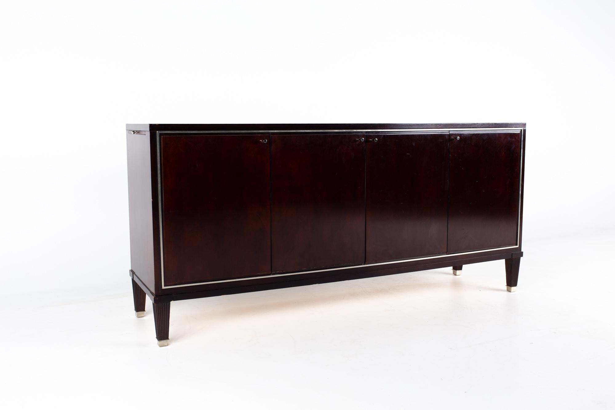 Barbara Barry for Baker Mahogany sideboard buffet Credenza

This sideboard measures: 69 wide x 18 deep x 32 inches high

About photos: We take our photos in a controlled lighting studio to show as much detail as possible. We do not photoshop out