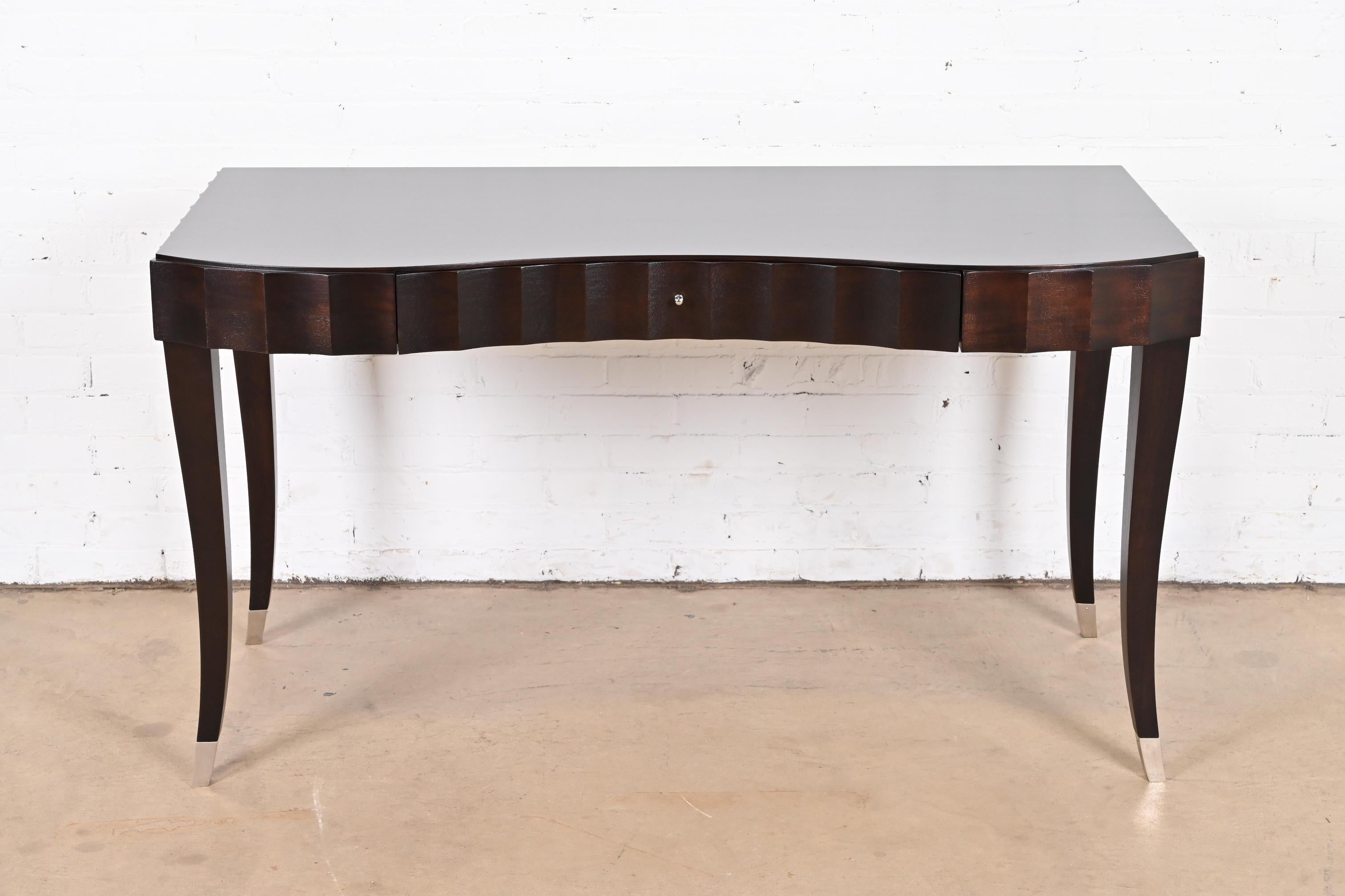 A gorgeous Modern Art Deco or Regency style dark mahogany writing desk or vanity

By Barbara Barry for Baker Furniture

USA, Circa 1990s

Measures: 53.75