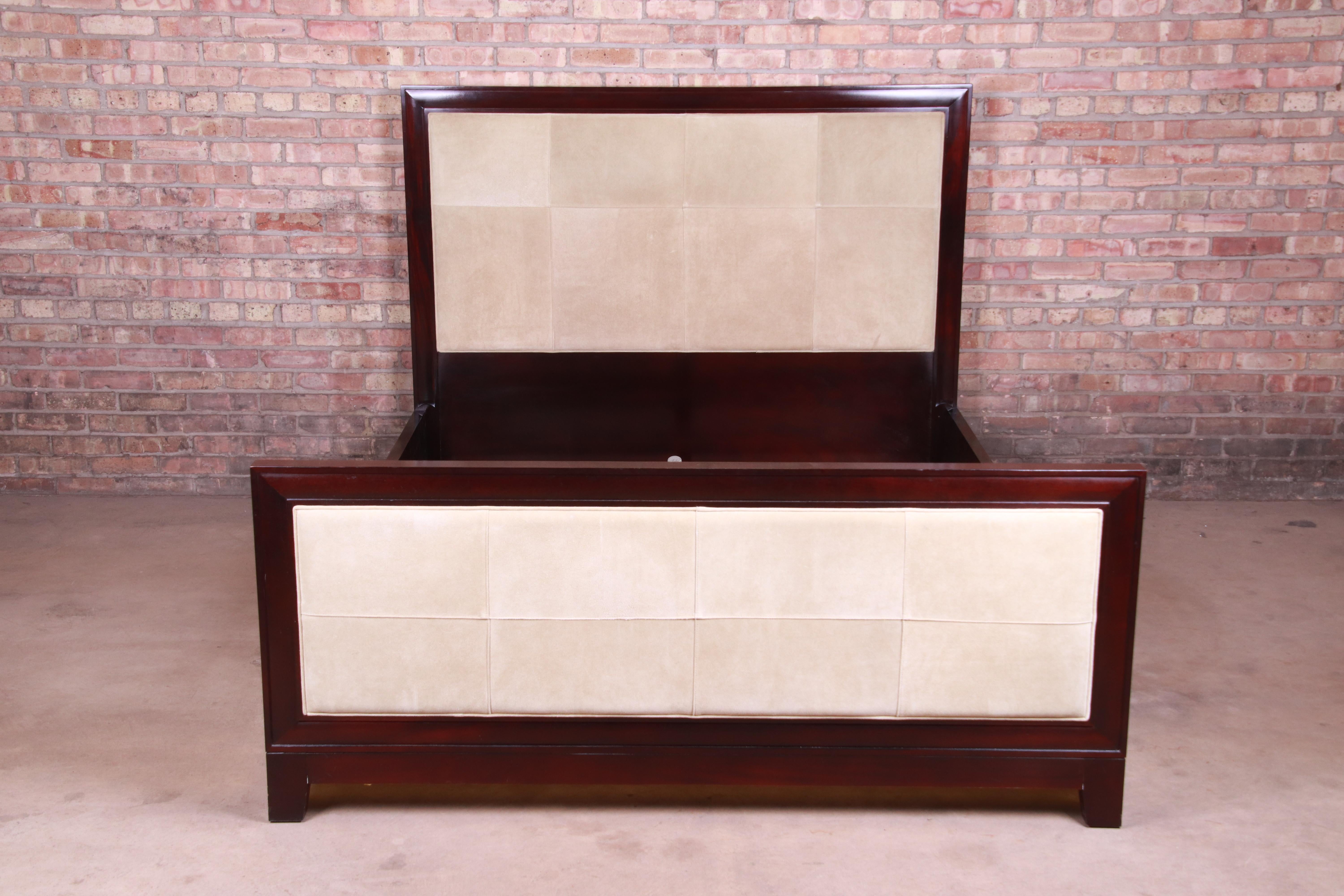 A gorgeous modern queen size bed frame

By Barbara Barry for Baker Furniture

USA, circa 1990s

Dark mahogany, with suede upholstered headboard and footboard.

Measures: 64.75