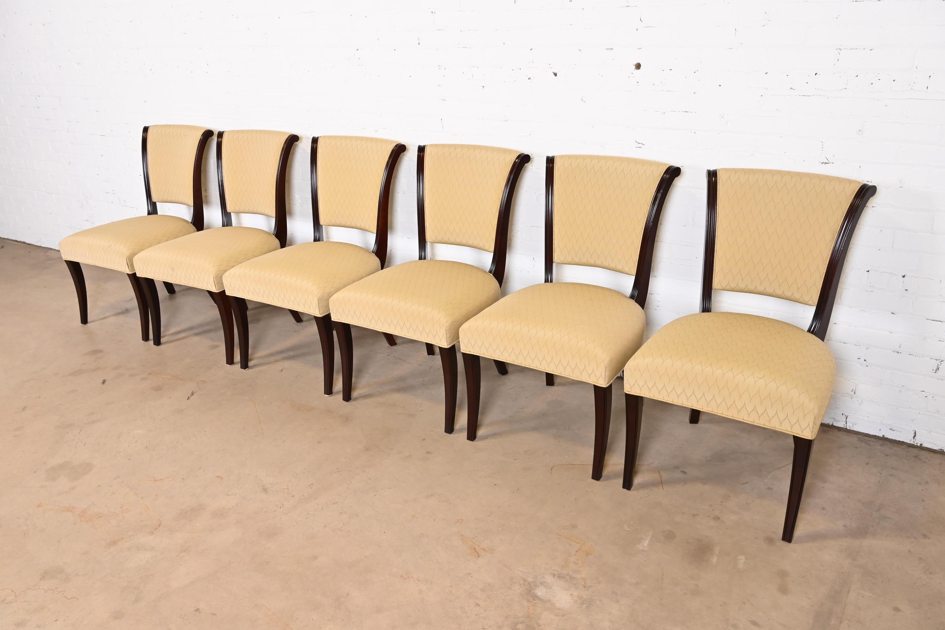 An exceptional set of six modern Regency style dining chairs

By Barbara Barry for Baker Furniture

USA, Circa 1990s

Dark mahogany frames, with upholstered seats and backs.

Measures: 21.5