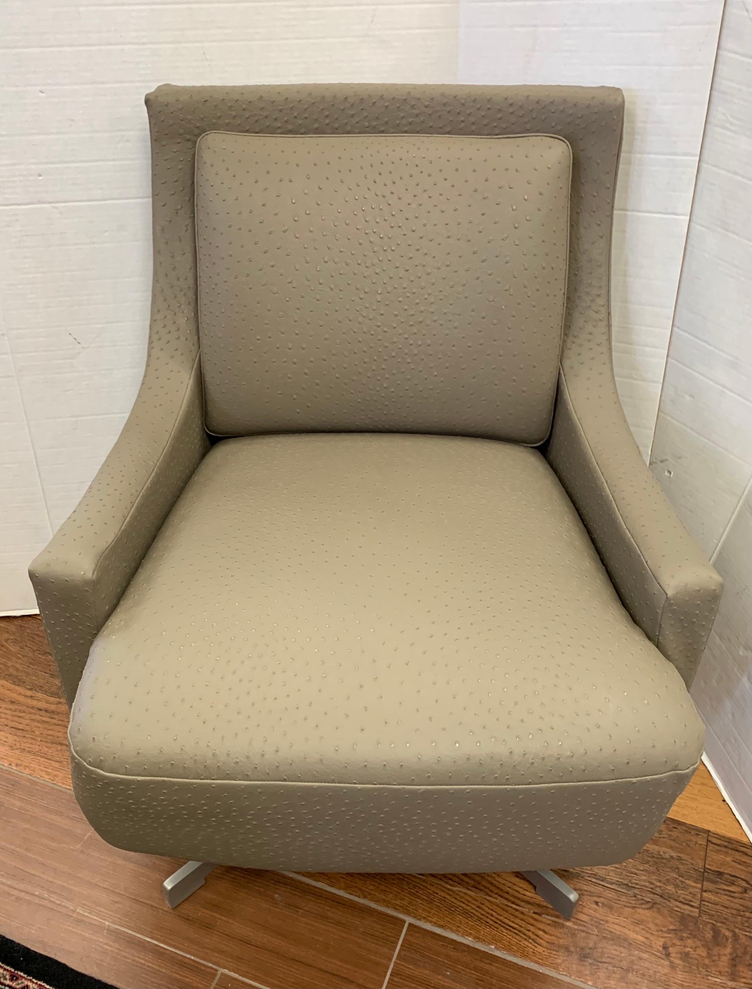 Barbara Barry for HBF swivel chair newly upholstered in Donghia low profile ostrich leather chair.
Very comfortable and sturdy with swivel option. Chair is supported by four prong self-center steel frame.
  