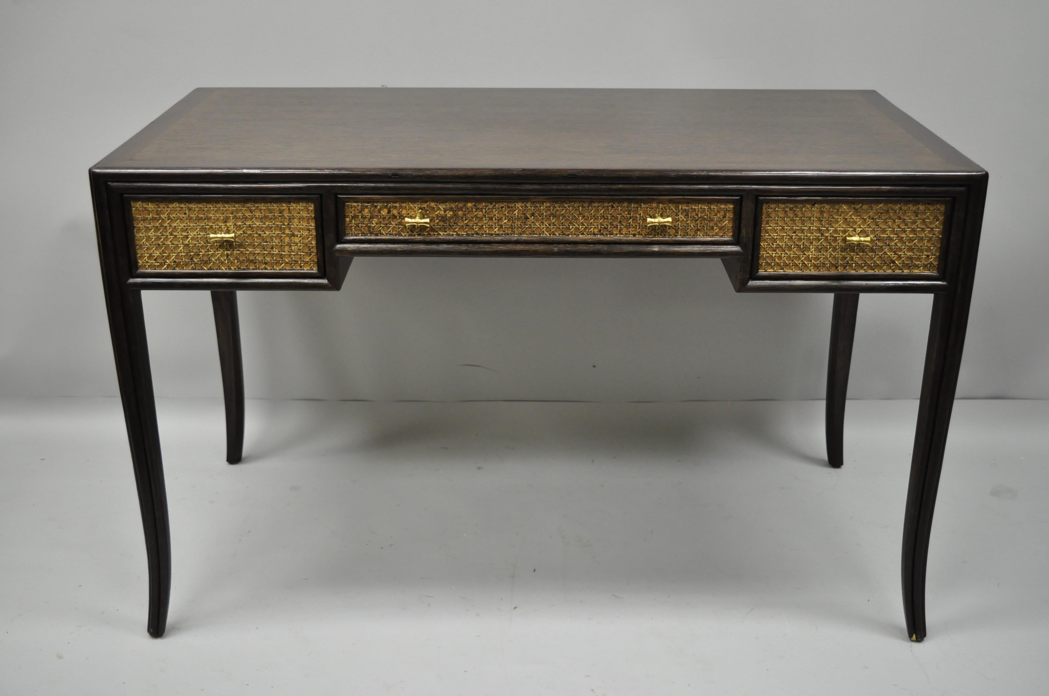Barbara Barry for McGuire oak and cane desk. Item features solid combed oakwood frame, cane fronts, sides and finished back, tapered legs, solid brass faux bamboo drawer pulls, original label, three drawers, and quality American craftsmanship, circa