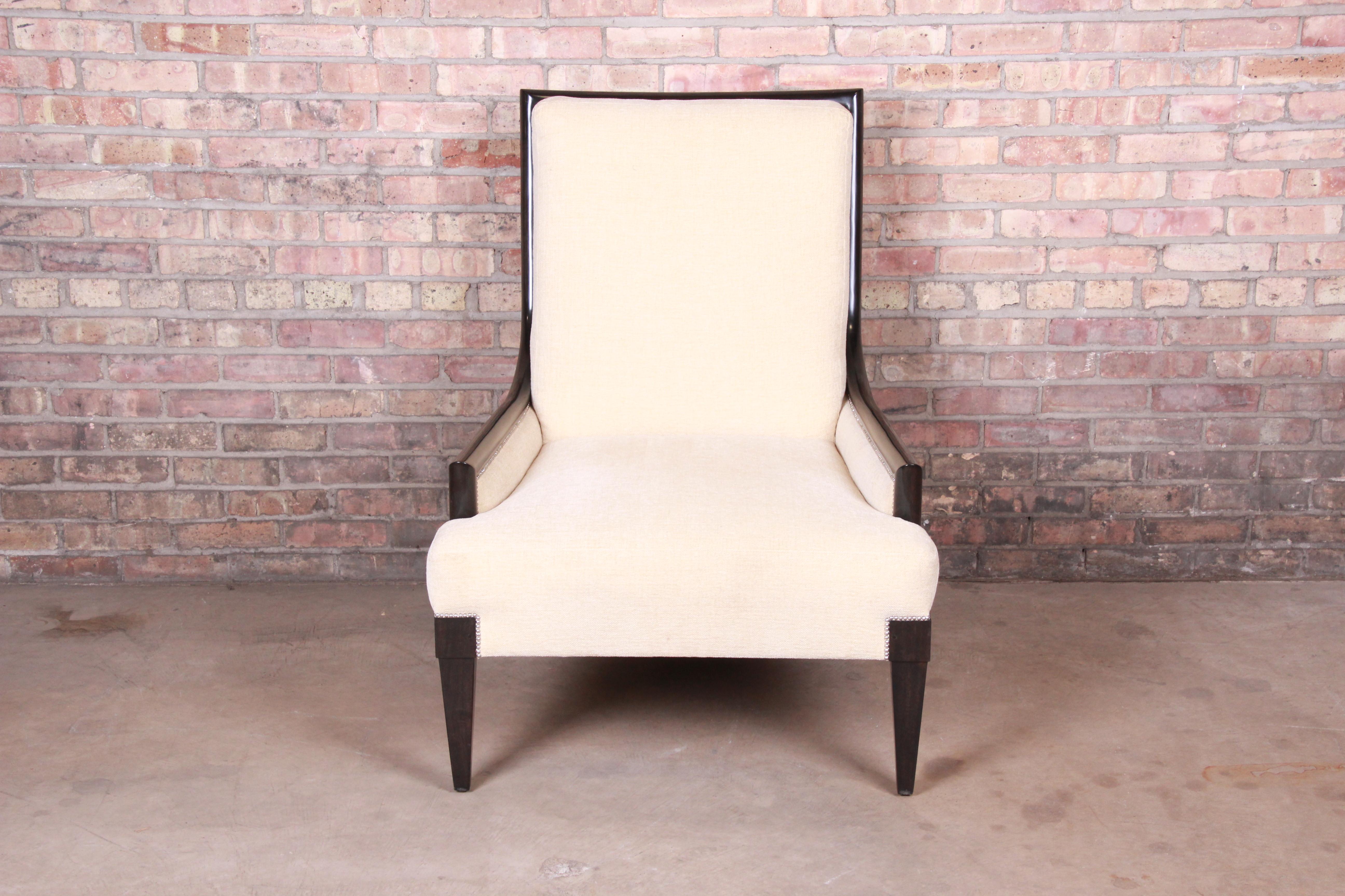 A gorgeous Barbara Barry style contemporary lounge chair

By William Switzer

Canada, circa 1990s

Solid mahogany frame, with cream upholstery.

Measures: 31.75