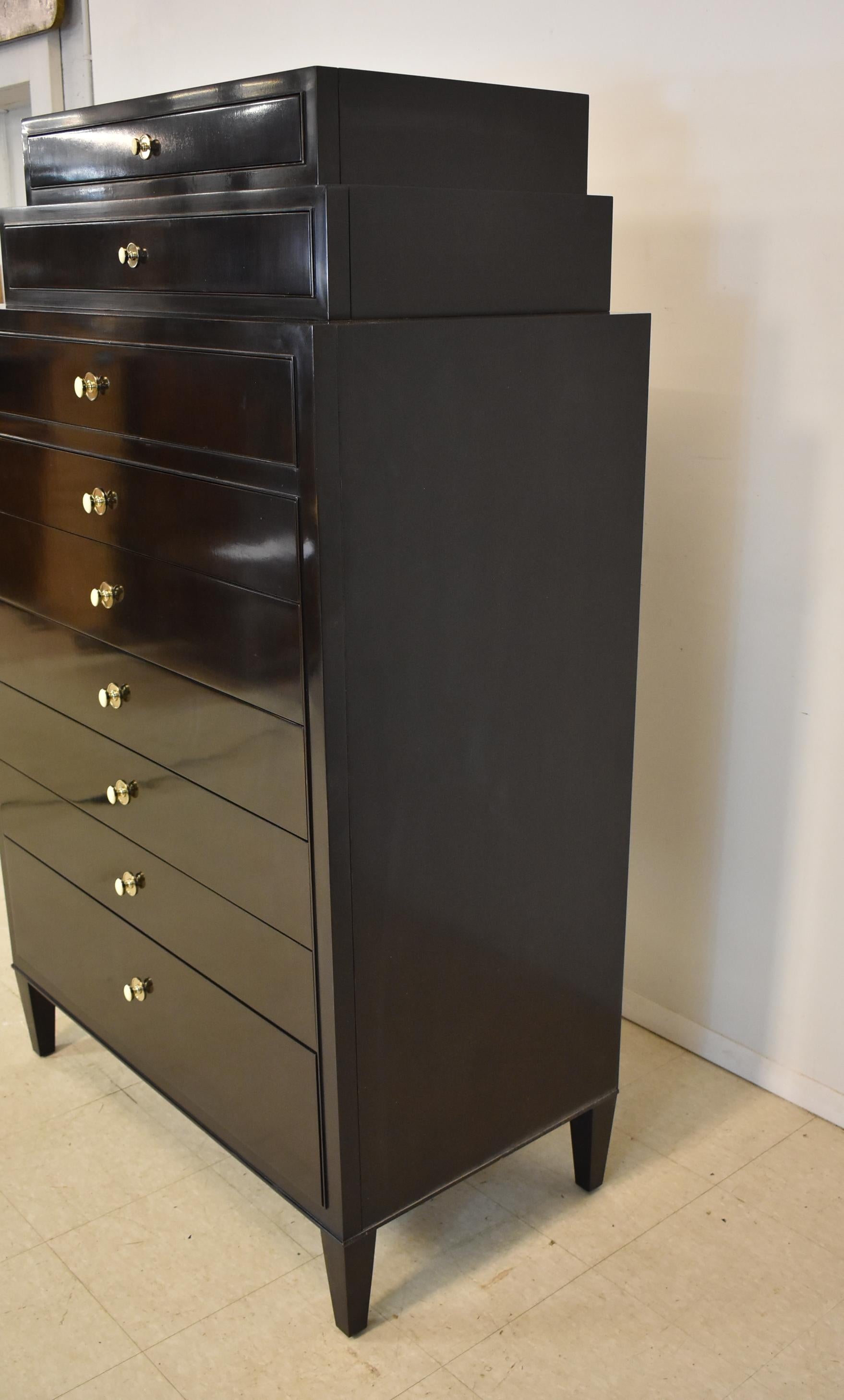 This tall tuxedo chest features dovetailed drawer construction, dark mahogany finish and felt lined top drawers. Designed by renowned American designer Barbara Barry for Henredon circa late 1990'2-early 2000. Very nice condition with light wear. 41