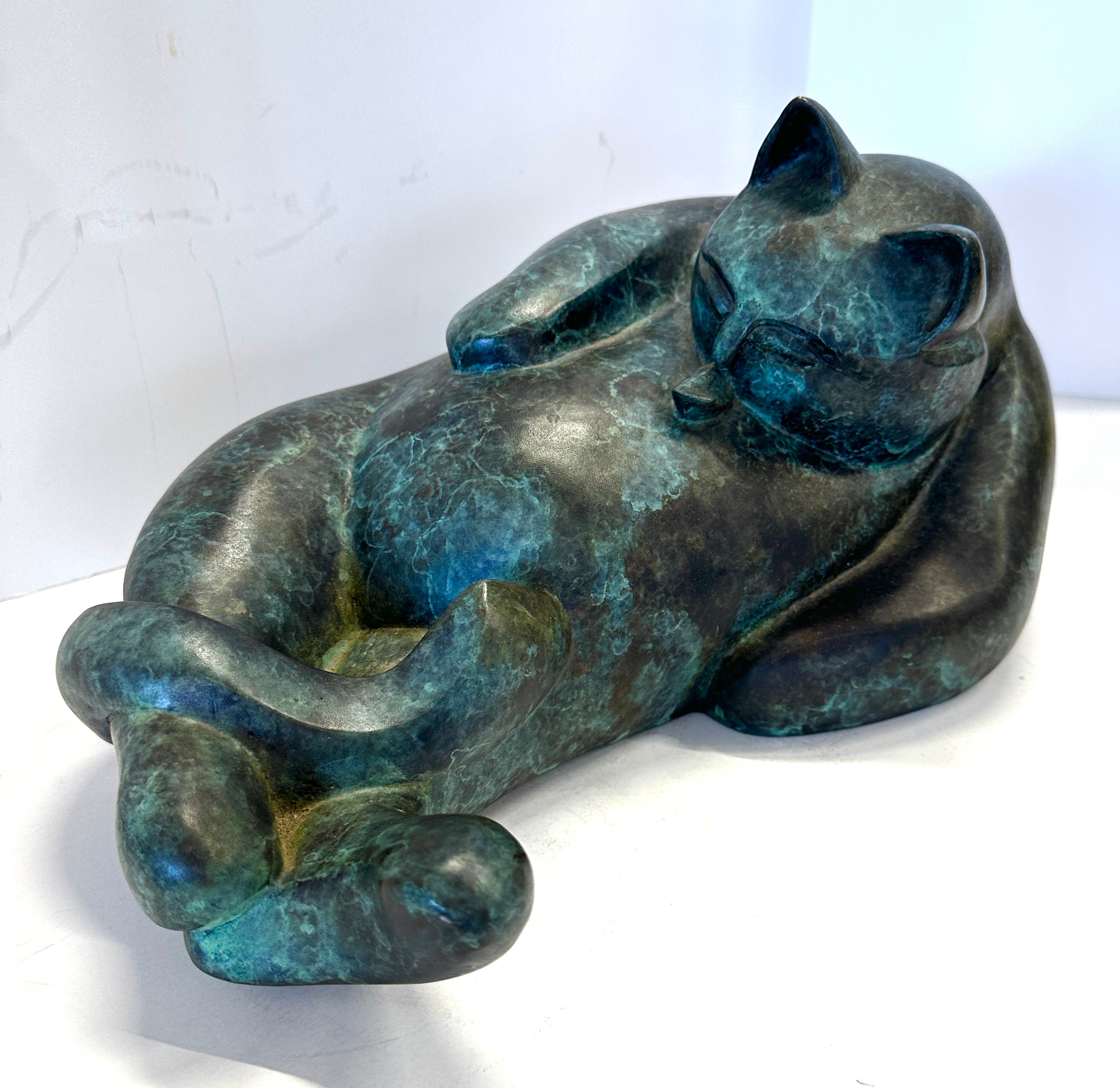 A wonderful bronze cat by the noted California artist Barbara Beretich. It is titled Tanko and is signed and dated underneath 9/21/96. It is numbered 6/24. It has developed a beautiful patina and is suitable for display indoors or outdoors.  It is