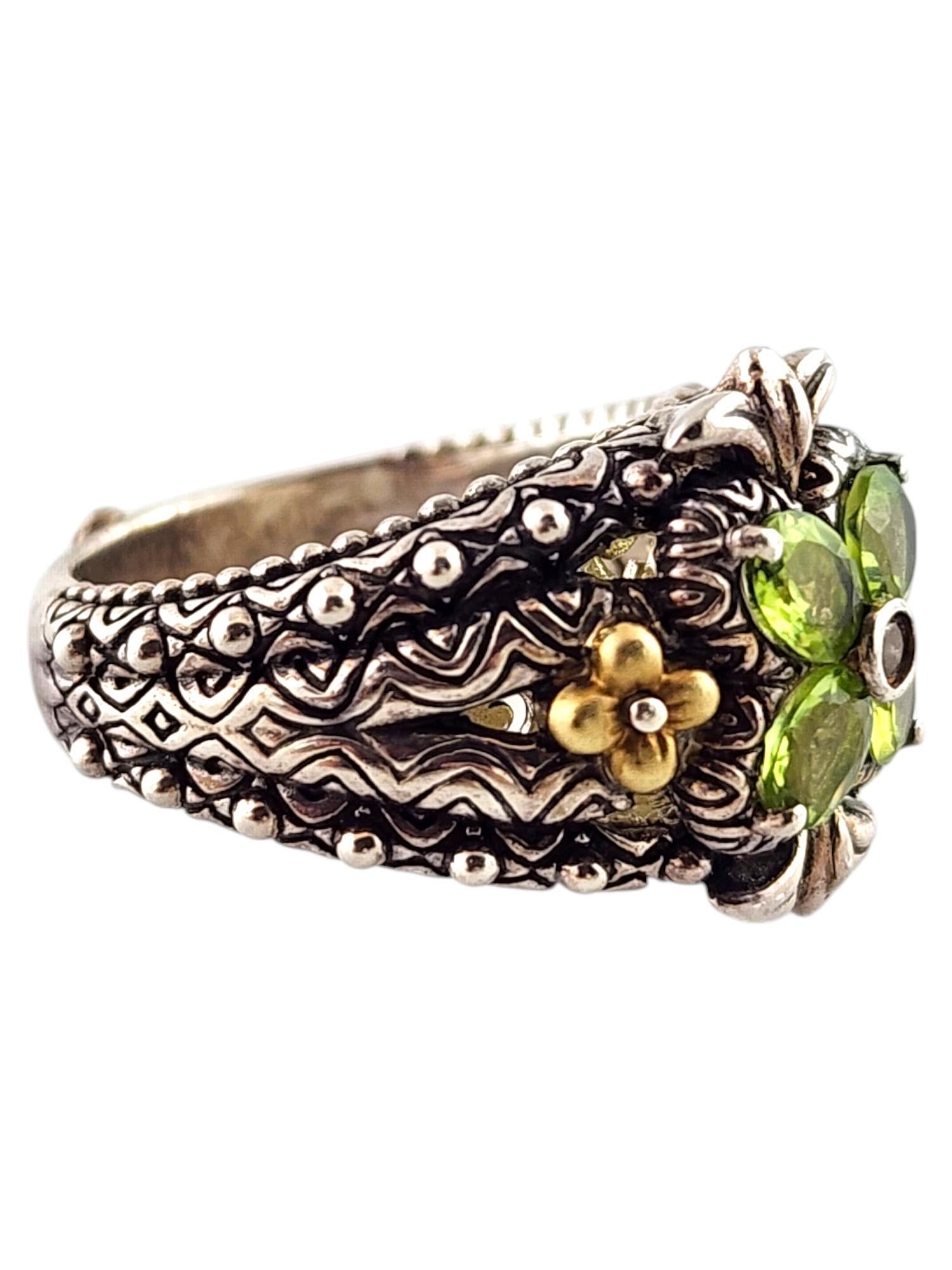 Barbara Bixby 18K Yellow Gold & Sterling Silver Peridot Flower Ring Size 9

This gorgeous ring by designer Barbara Bixby was crafted from sterling silver with beautiful 18K yellow gold detailing and a stunning lotus flower created with 4 green and