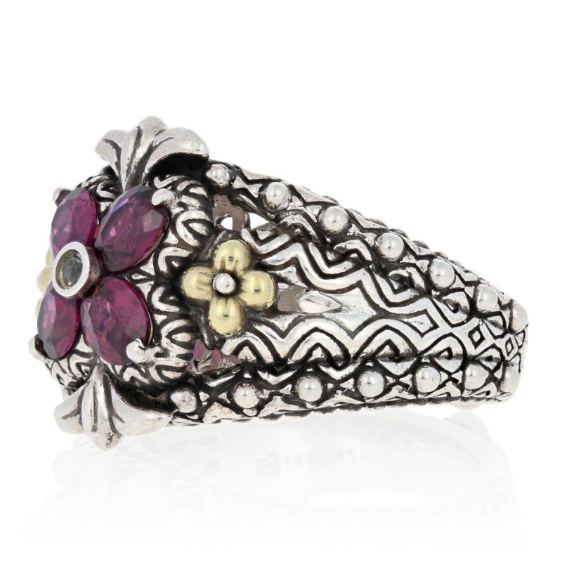 This ring is a size 7.

Brand: Barbara Bixby

Metal Content: Guaranteed Sterling Silver & 18k Gold as stamped

Stone Information: 
Genuine Rhodolite Garnets 
Color: Purplish Red
Cut: Oval
 
Genuine Topaz 
Color: White
Cut: Round

Face Height (north