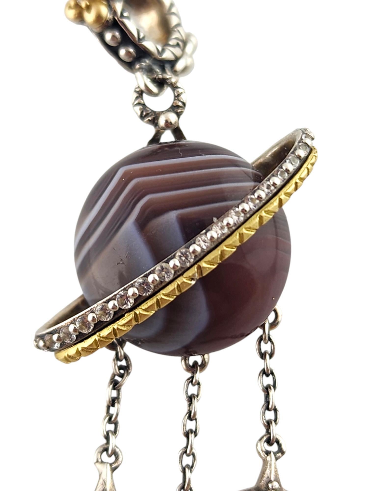 Barbara Bixby Sterling Silver & 18K Yellow Gold Planet & Stars Enhancer Pendant

This gorgeous agate topaz and gemstone planet enhancer pendant features dangling stars and was meticulously crafted from sterling silver with 18K yellow gold