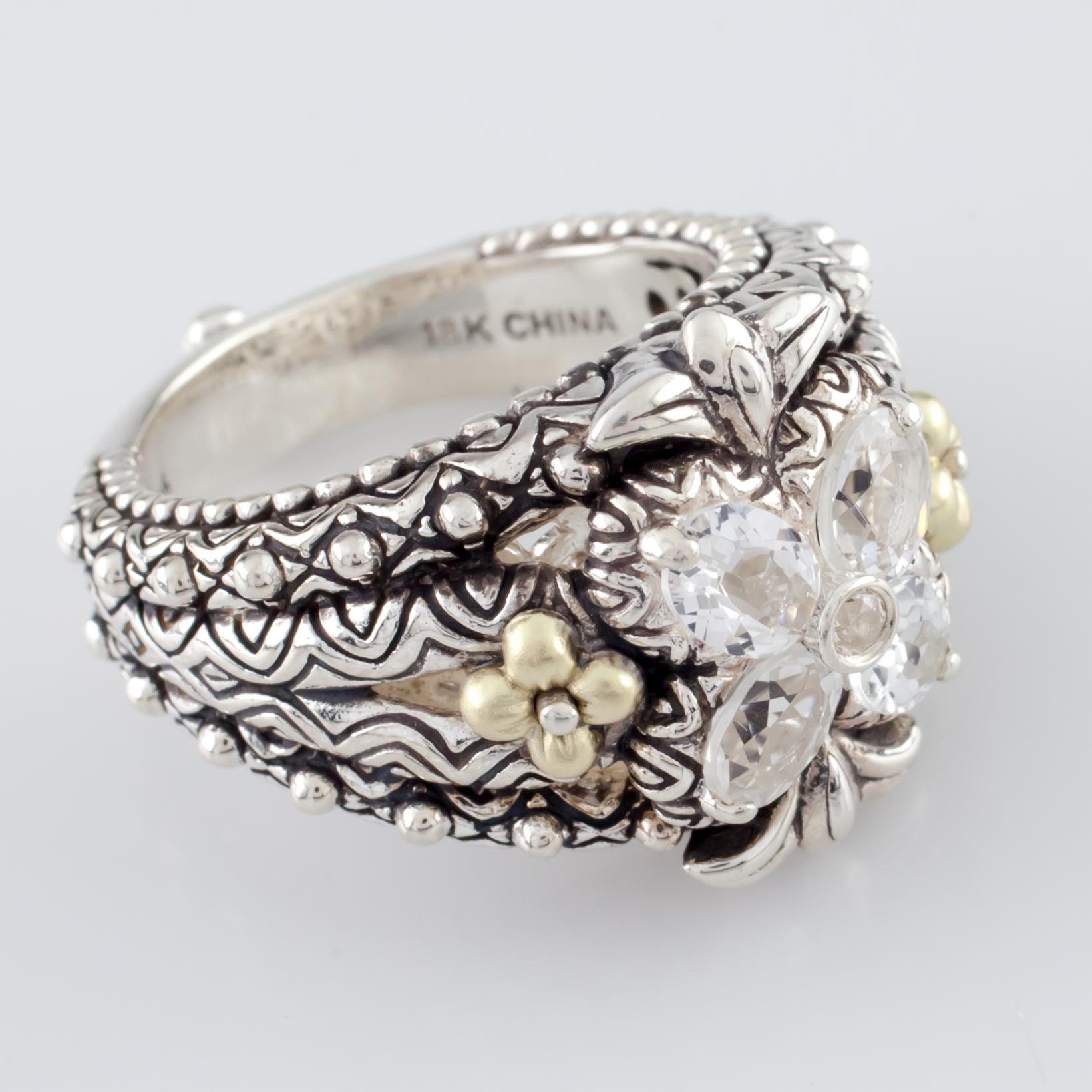 Gorgeous Textured Ring by Barbara Bixby
Features Four Oval Cut Clear Quartzes in Floret Shape
18k Yellow Gold Accents
Total Mass = 13.9 grams
Size 7
Gorgeous Piece!