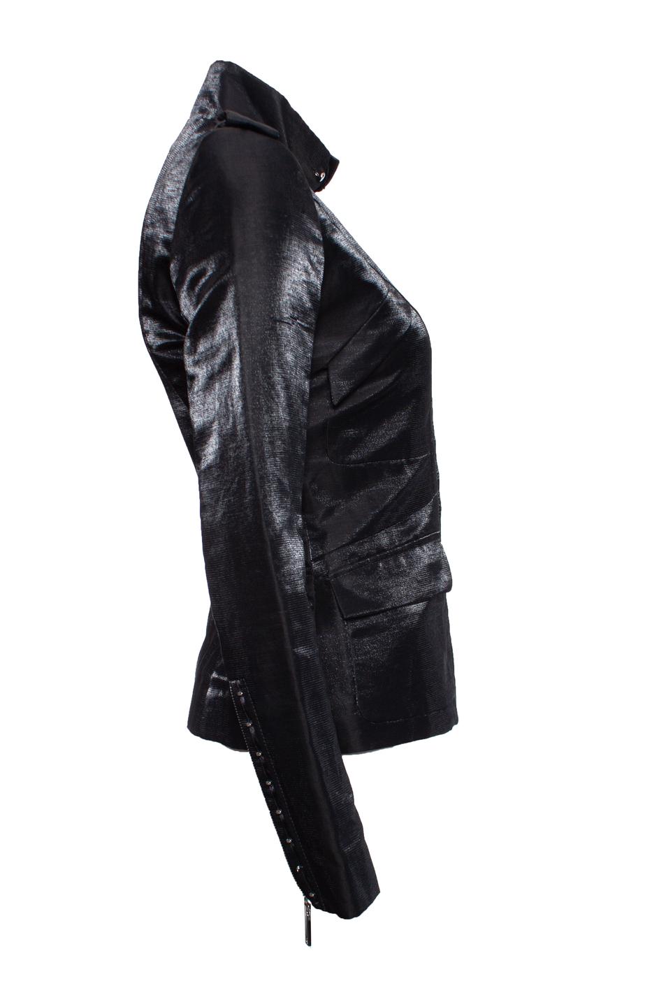 Barbara Bui, Black Shiny military jacket with blue glow. The item is in very good condition. Has two pockets at the waist and two pockets on the chest, a zipper closure and a corset closure next to the zipper for decoration.

• CONDITION: very good