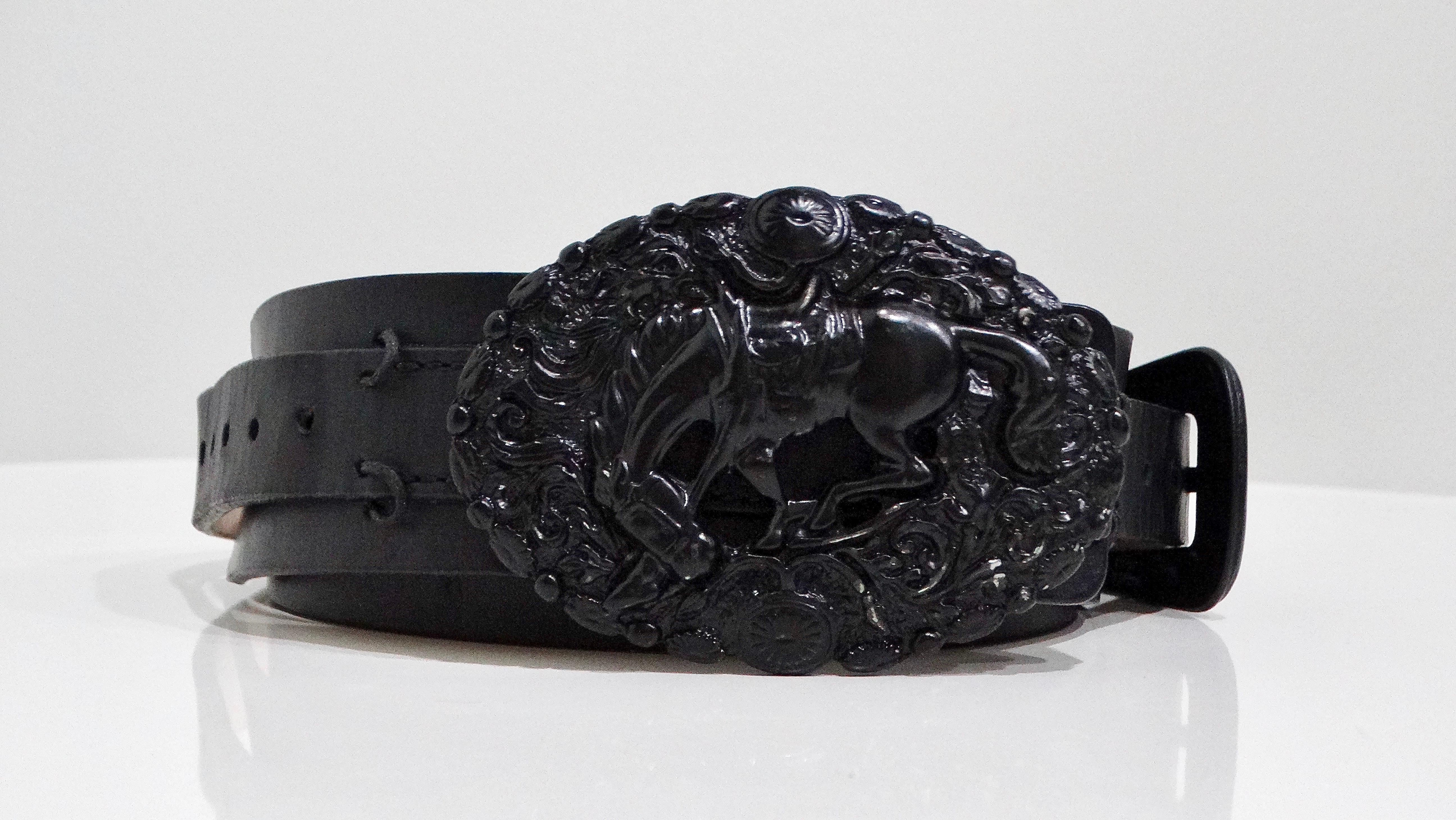 The Barbara Bui belt is an extraordinary accessory that blends a unique western motif with modern sophistication. Made from high-quality black leather, this belt features a striking centerpiece of a bucking bronco, adding a playful yet sleek touch