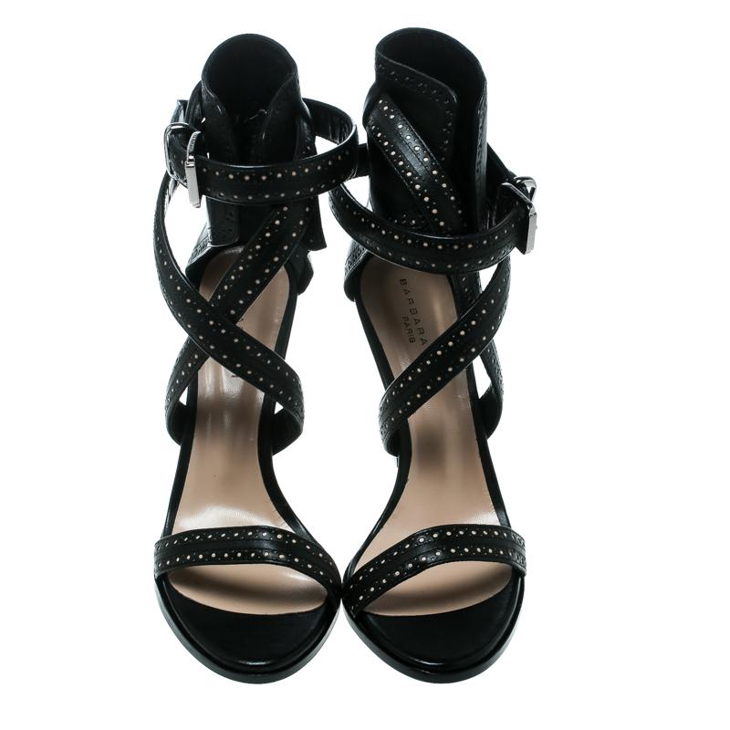 These sandals from Barbara Bui are utterly gorgeous! The sandals are crafted from leather and designed with perforated accents and straps that ends as cuffs around the ankles. Balanced on 10.5 cm block heels, this lovely pair will have everyone in