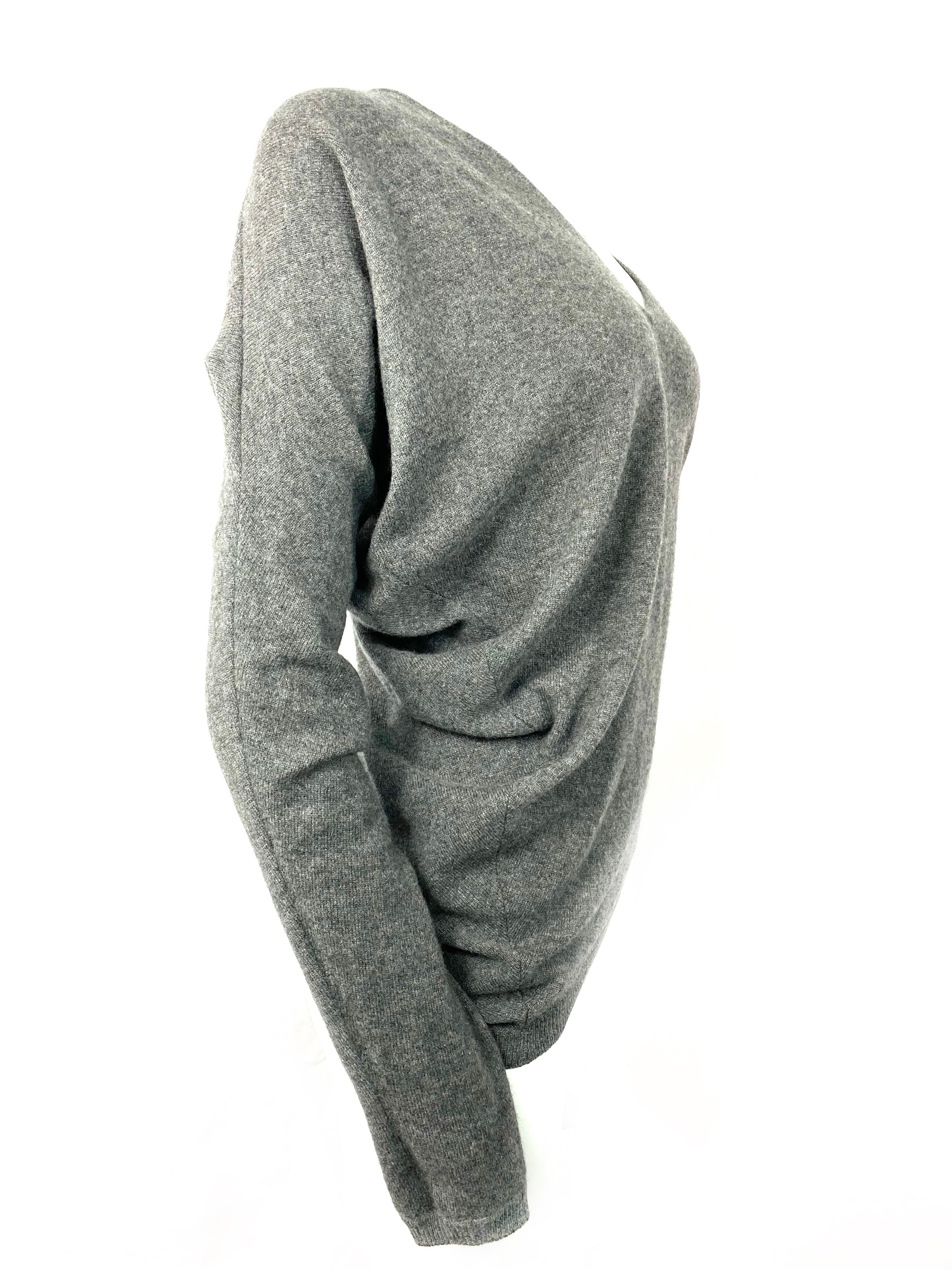 Product details:

Size Small.
Featuring grey cashmere, long sleeves, v neck, asymmetrical design. 