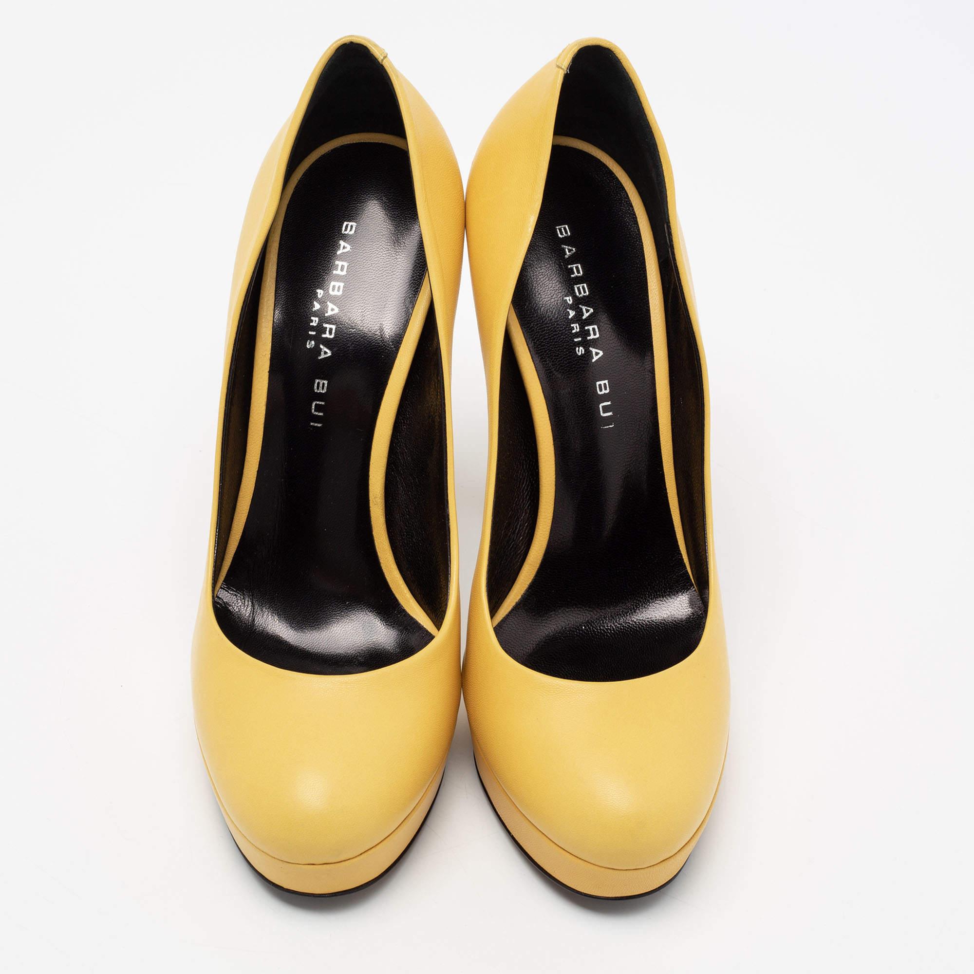 Lend an uber-chic look to your ensemble in this pair of leather pumps. With this one, Barbara Bui has brought yet another comfortable pair of footwear. Upgrade your everyday look by pairing your outfit with these yellow platform