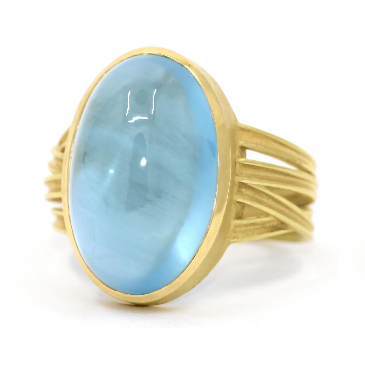 One of a Kind Ribbon Wrap Ring handmade by acclaimed jewelry artist Barbara Heinrich showcasing an exceptional 13.99 carat gem aquamarine oval cabochon that radiates light from within, bezel-set in Barbara's signature-finished 18k yellow gold atop