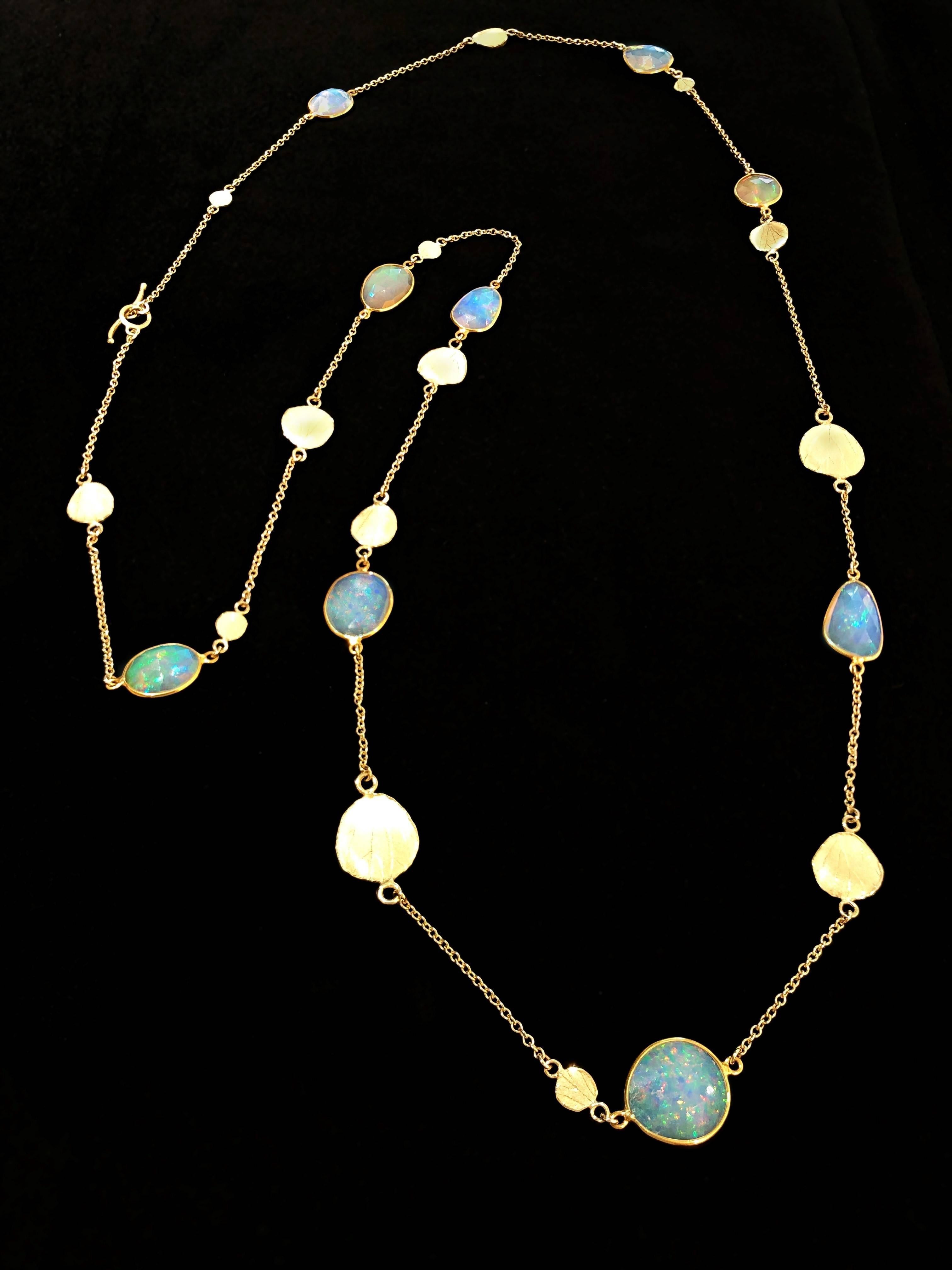 Long Petals Necklace handcrafted by award-winning jewelry artist Barbara Heinrich in matte-finished 18k yellow gold with nine faceted rose-cut Ethiopian opals and accented by 18k yellow gold petal spacers and lobster clasp. 36