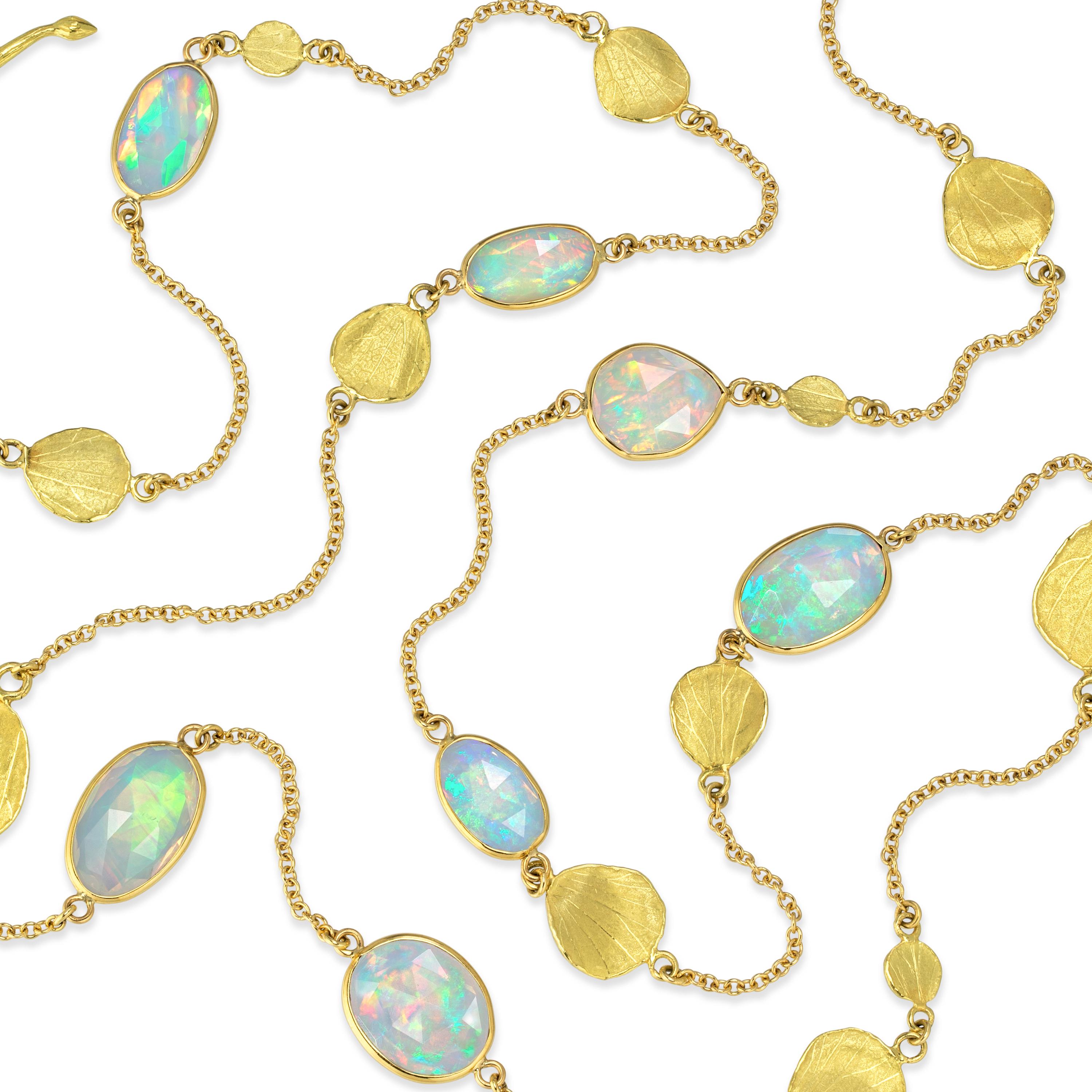 Long Petals Necklace handcrafted by award-winning jewelry artist Barbara Heinrich in matte-finished 18k yellow gold featuring eight faceted rose-cut Ethiopian opals totaling 16.58 carats, bezel-set and accented by 18k yellow gold petal spacers and