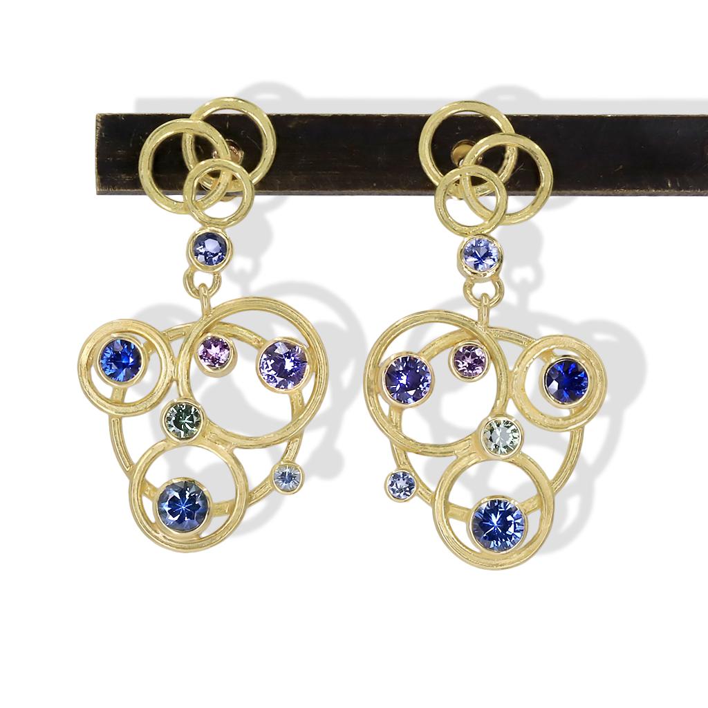 One of a Kind Circle Drop Earrings intricately hand-fabricated by award winning jewelry maker Barbara Heinrich in signature finished 18k yellow gold featuring 0.45 total carats of round brilliant-cut purple sapphires, 1.0 carat of round