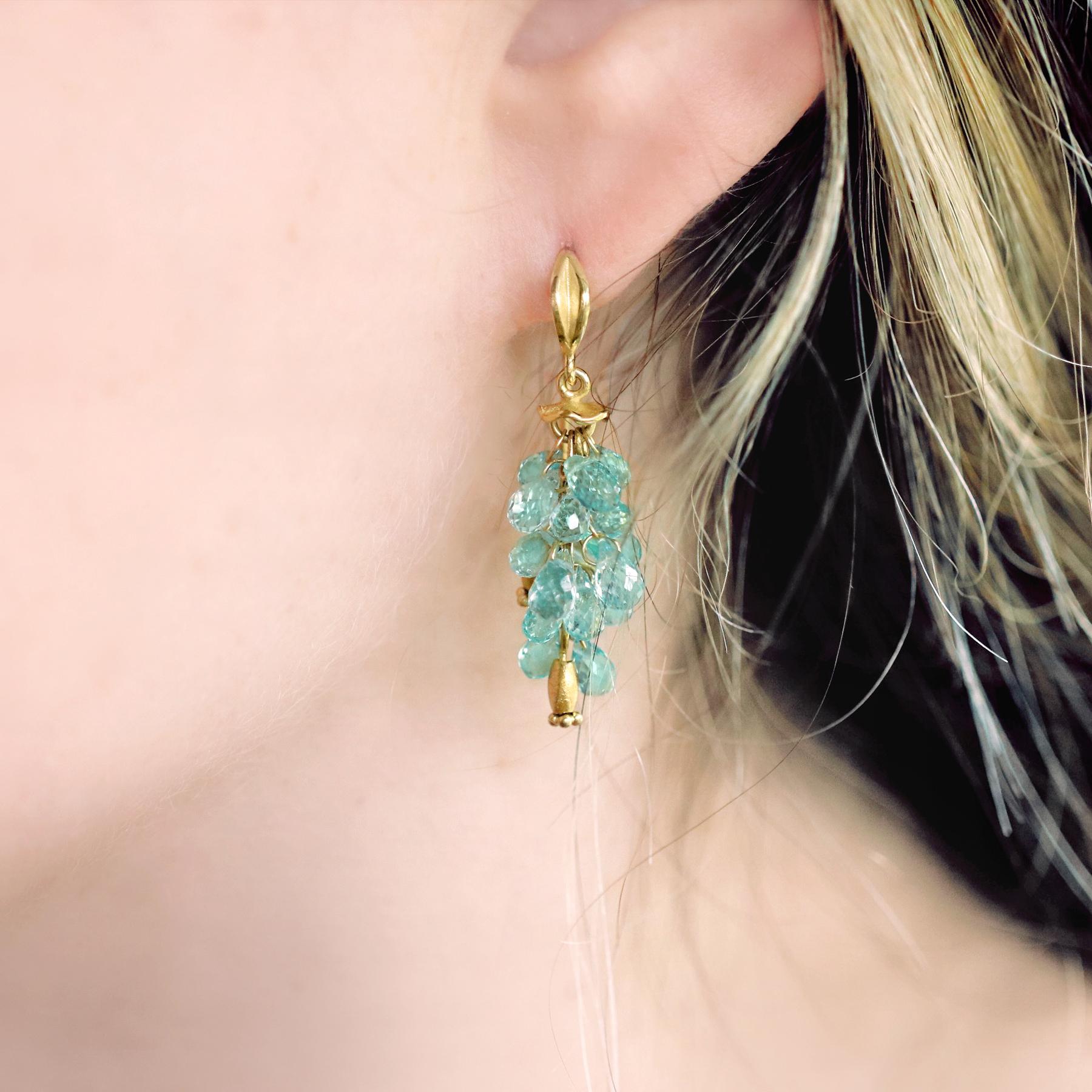 Navette Dangle Drop Earrings handcrafted by award-winning jewelry maker Barbara Heinrich in signature-finished 18k yellow gold showcasing 9.80 total carats of beautiful, faceted seafoam emerald briolettes and accented with wavy tops and leaf petal