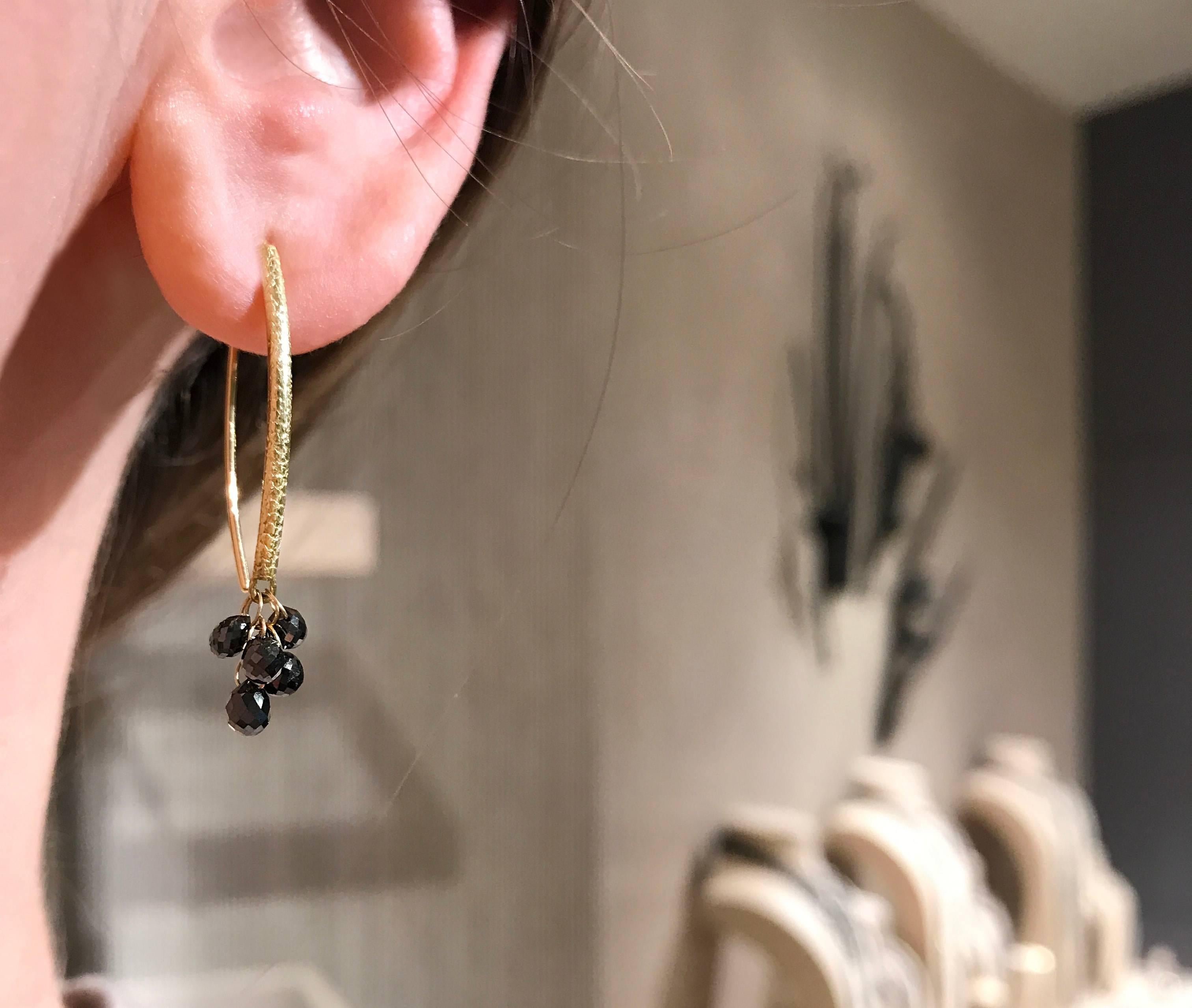 Drop Earrings handcrafted by award-winning jewelry artist Barbara Heinrich in matte-finished 18k yellow gold with 10 faceted black diamond briolettes totaling 2.47 carats and attached by individual dangling 18k yellow gold loops.