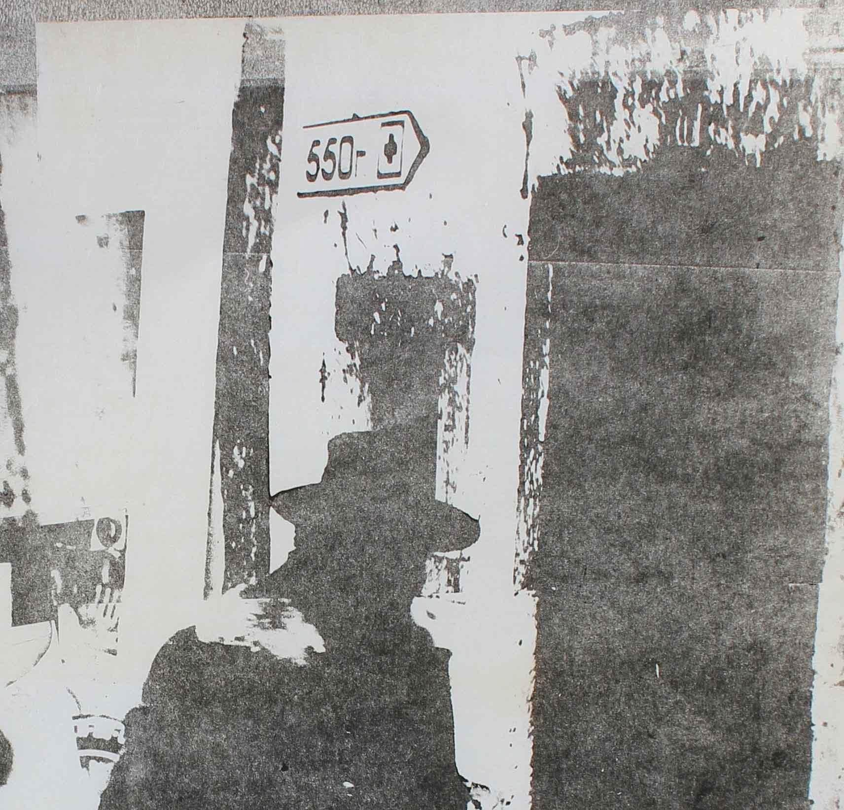 Men with Hats in Cityscape, Photo Emulsion Print, Circa 1970s - Gray Portrait Print by Barbara Lewis