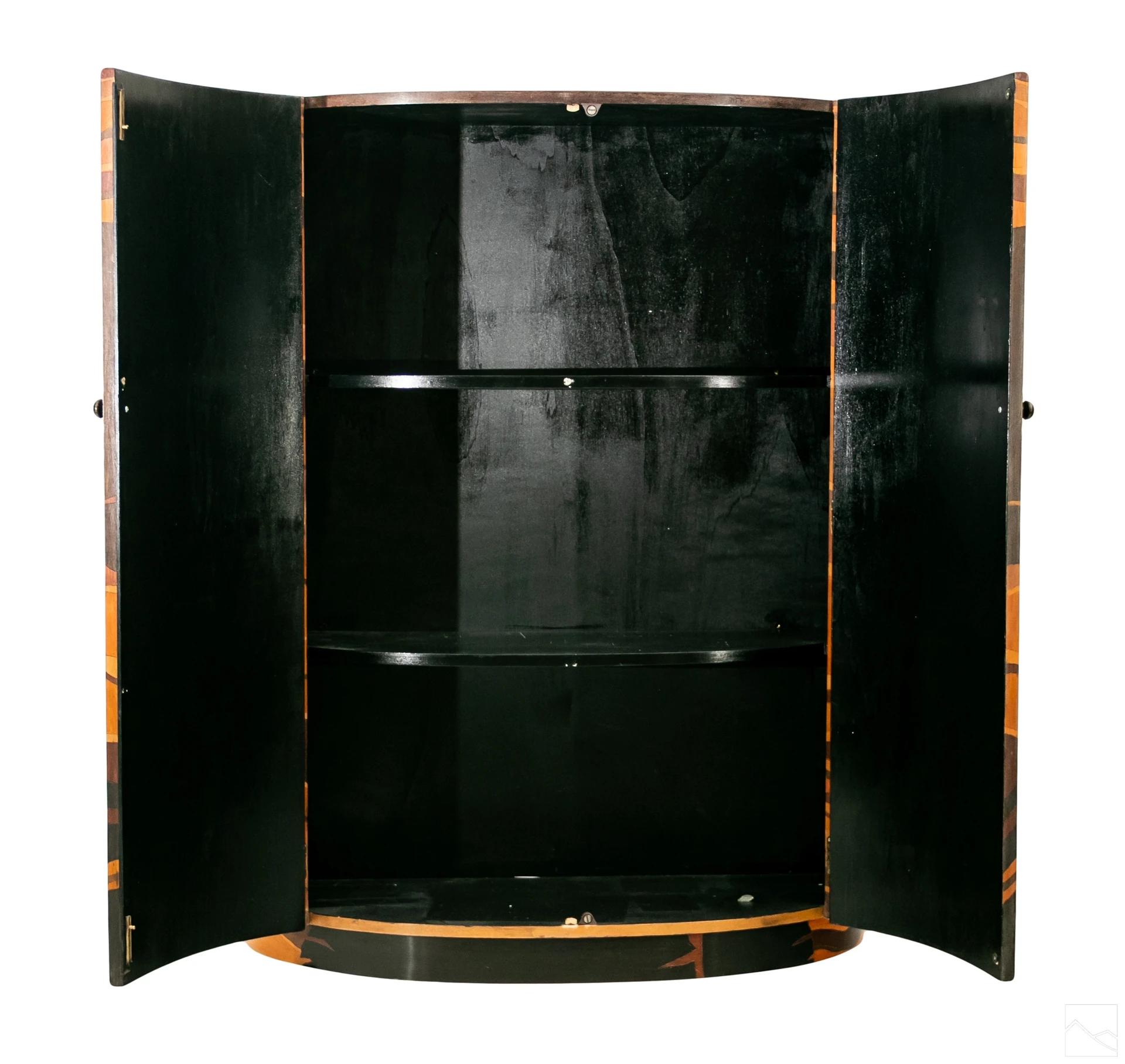 Barbara Mastroianni (Italian, 1951-2018). Exceptional piece with great history. Contemporary demi-lune form cabinet inlaid with designs of palm fronds on a ground of wood inlays of various exotic types. Interior having black painted finish with two