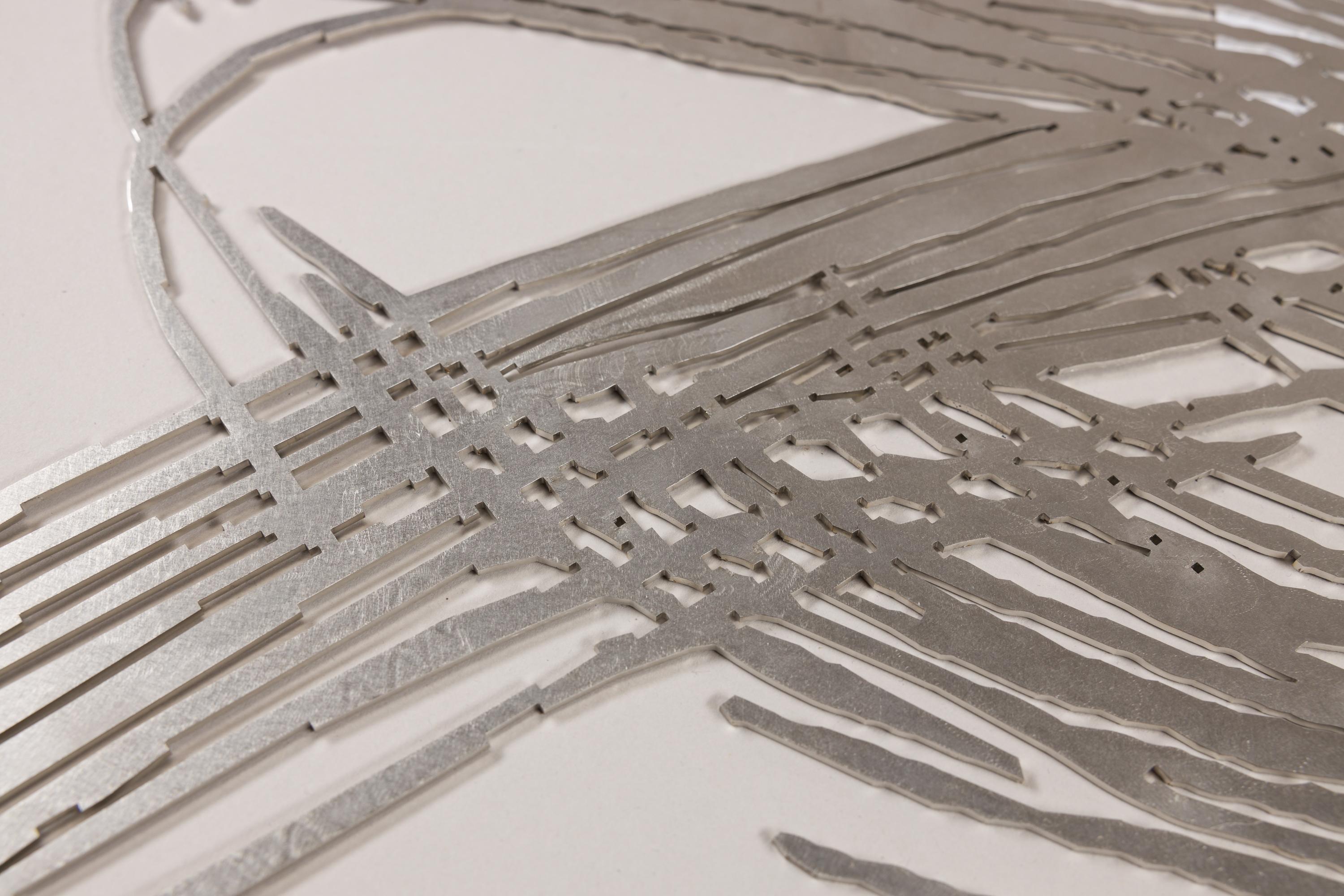 „The path to the freestanding sculpture led through relief work. Using a digitized original drawing, I bring forth the sculptures that are later created with laser or water jet cutting. The sculpture emerges from the sheet metal. Through this