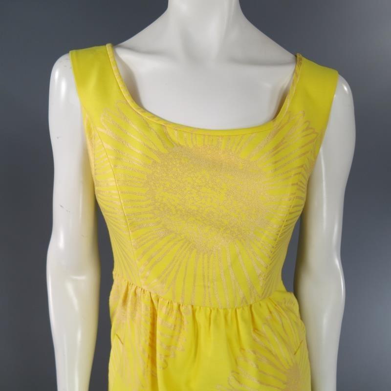 This lovely sleeveless summer dress by BARBARA TFANK comes in a yellow sunflower printed silk material and features a scoop neck, gathered waist, and frontal pockets. Made in USA.
 
Excellent Pre-Owned Condition.     
Marked: 6
 
Measurements:
