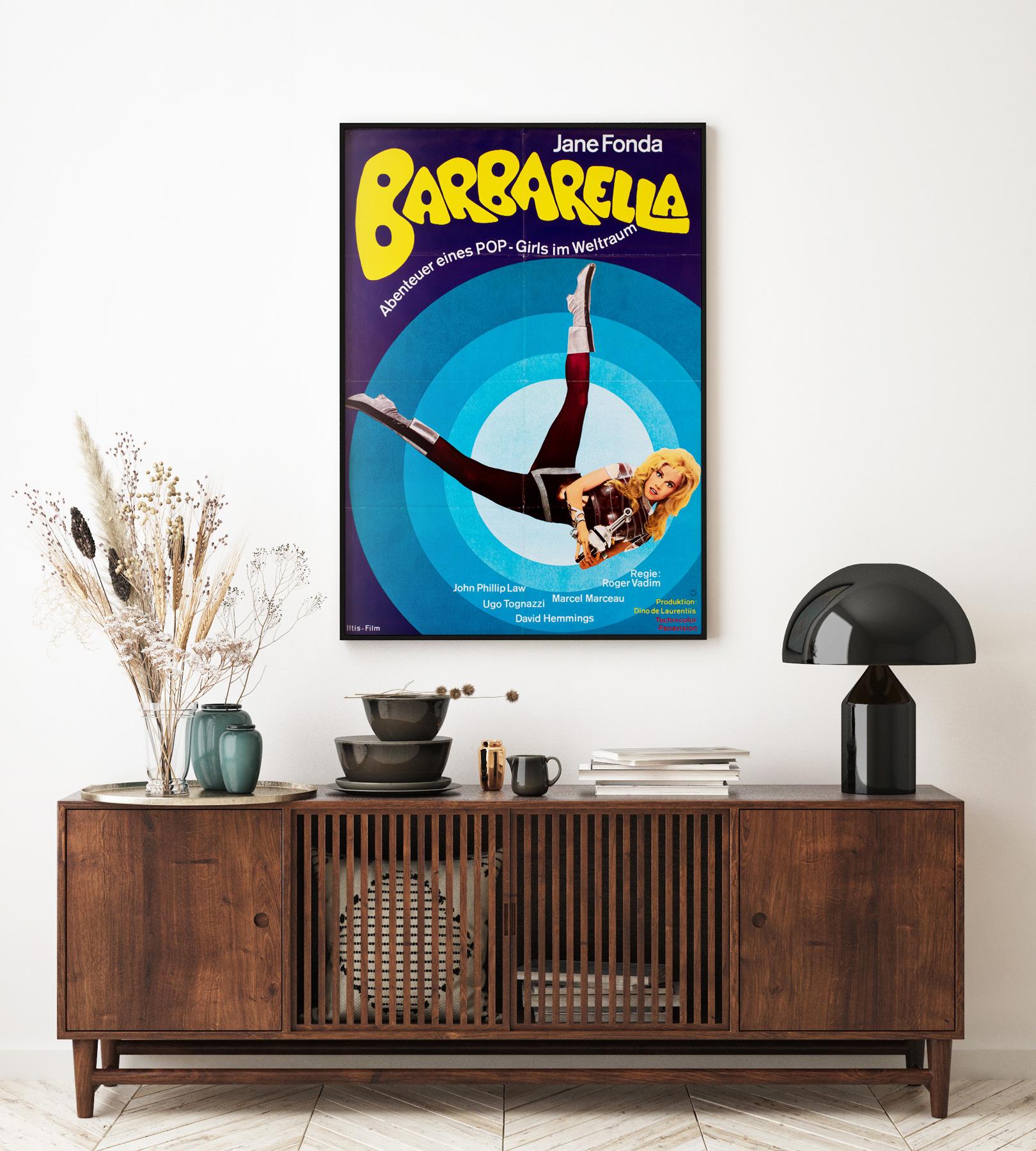 We love the colours and pop-art styling on this German 70s re-release film poster for 60s classic Barabrella. Barbarella is a film that inspired some wonderfully poster imagery and this one is no exception.

This original vintage movie poster is