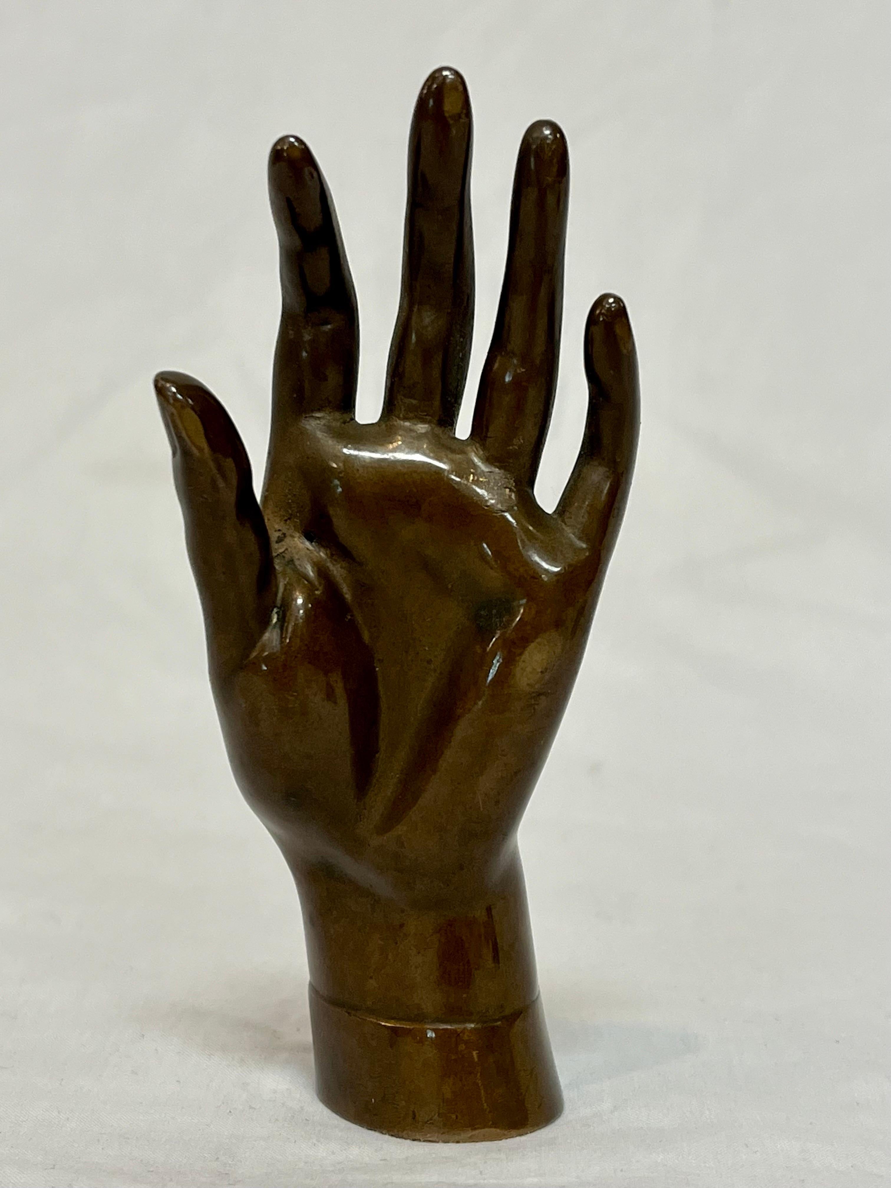 A gorgeously refined and delicate bronze hand paperweight by Barbedienne. The story goes that this is the hand of Grand Duchess Maria Pavlovna. But that's the story, not the history. I'm not sure if this is her hand. To further complicate the story,