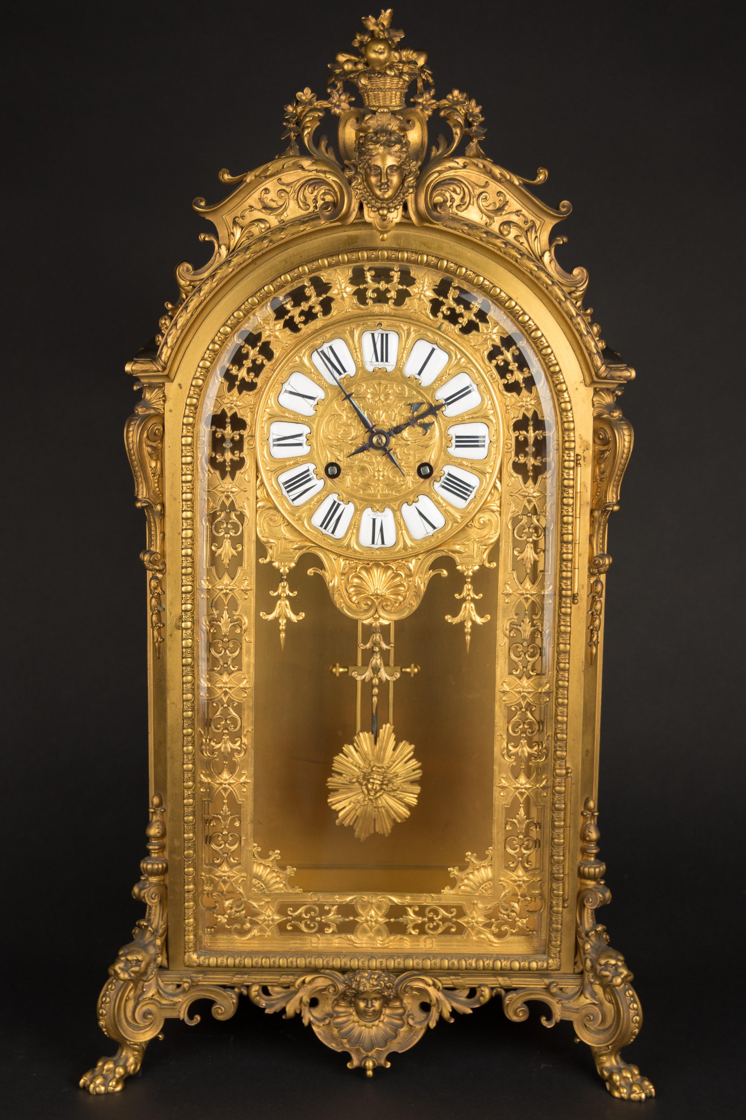 A fine quality Louis XV style French gilded ormolu clock, signed F.Barbedienne,
with white enamel roman numerals. Ferdinand Barbedienne was a French metalworker and manufacturer, who was well known as a bronze founder.