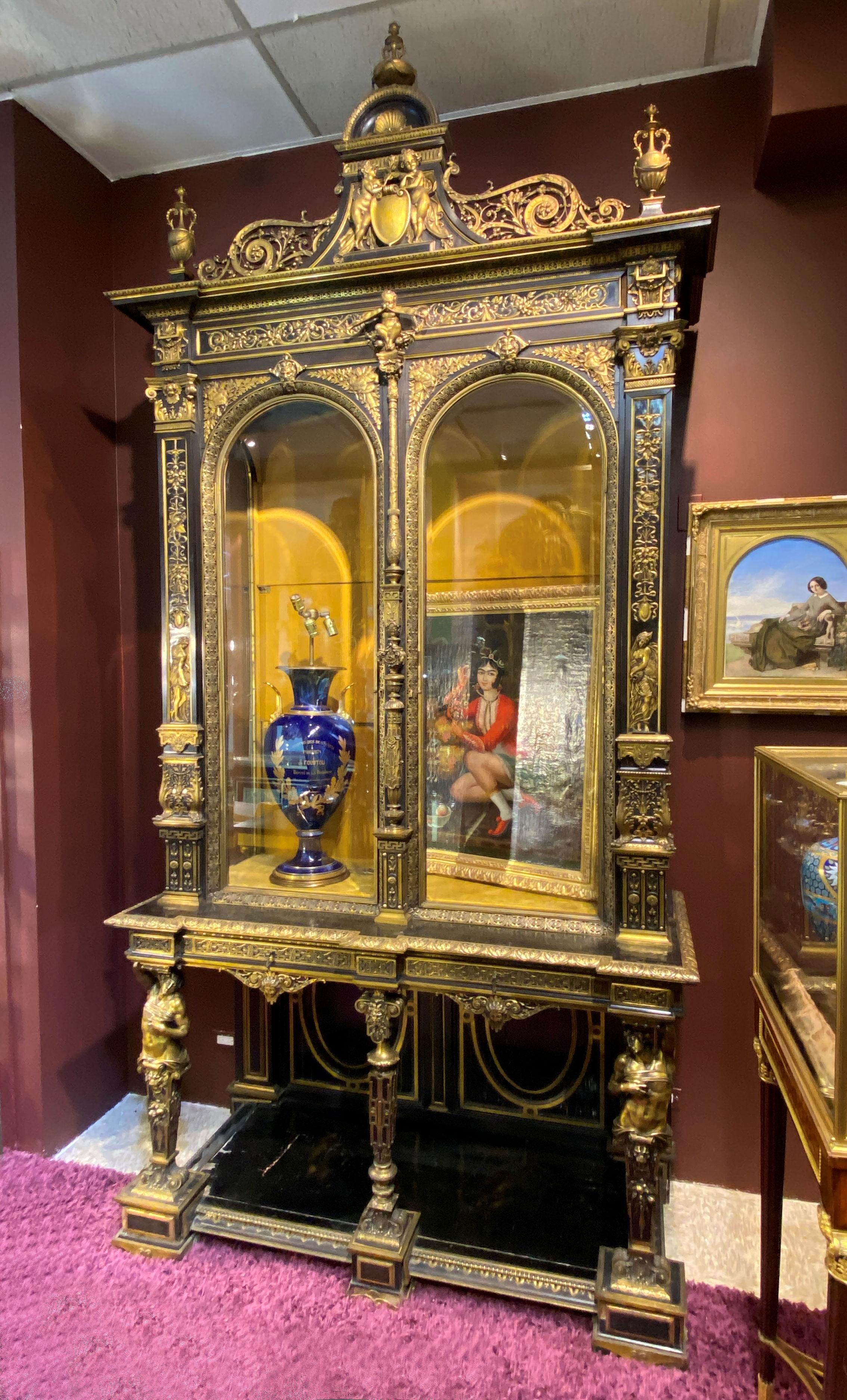 Our monumental ebonized cabinet with gilt bronze mounts, designed by Louis-Constant Sevin (1821-1888) for Barbedienne, is believed to be one of a handful of its kind. The original with silver-gilt mounts debuted at the International Exhibition of