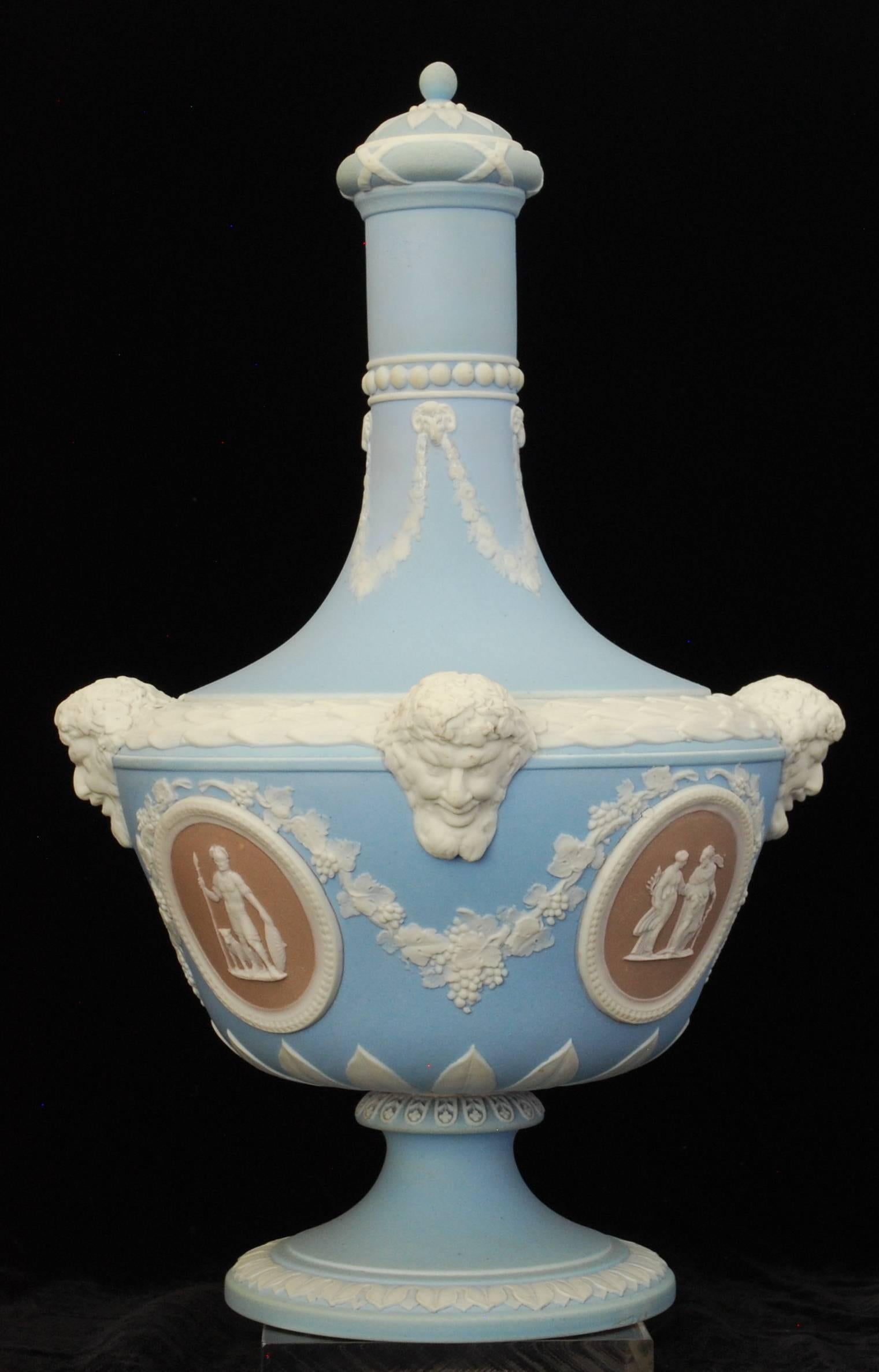 Vase in the ‘Barber Bottle’ shape, in old pale blue with lilac medallions showing Aesculapius & Hygeia, Fame inscribing a vase to Elisabeth, Abundantia, and Mars (God of War).