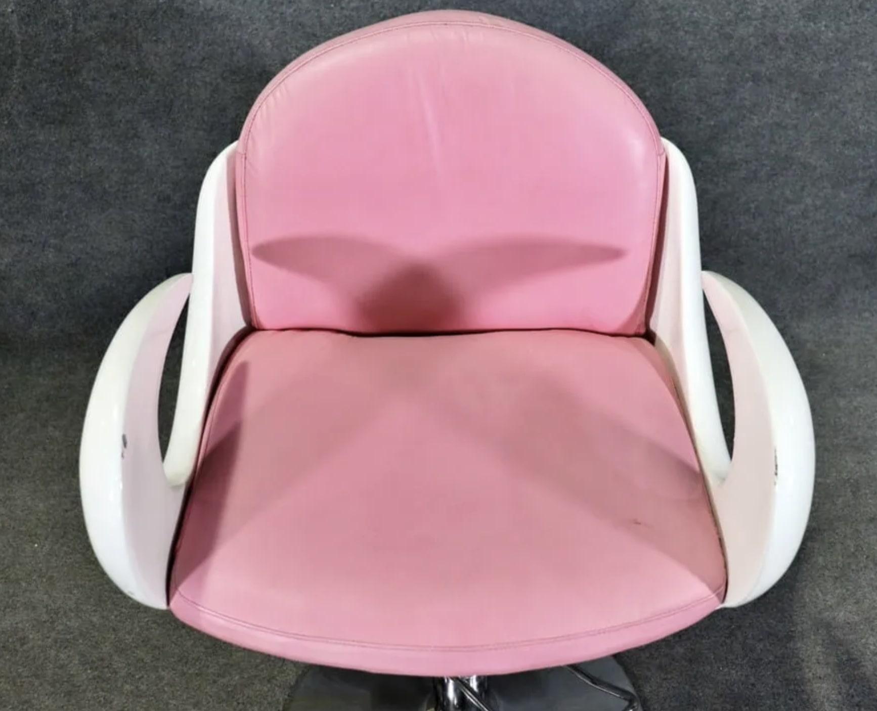 Rare barbershop chair in white and pink. Curled arms and polished metal base.
Please confirm location NY or NJ
