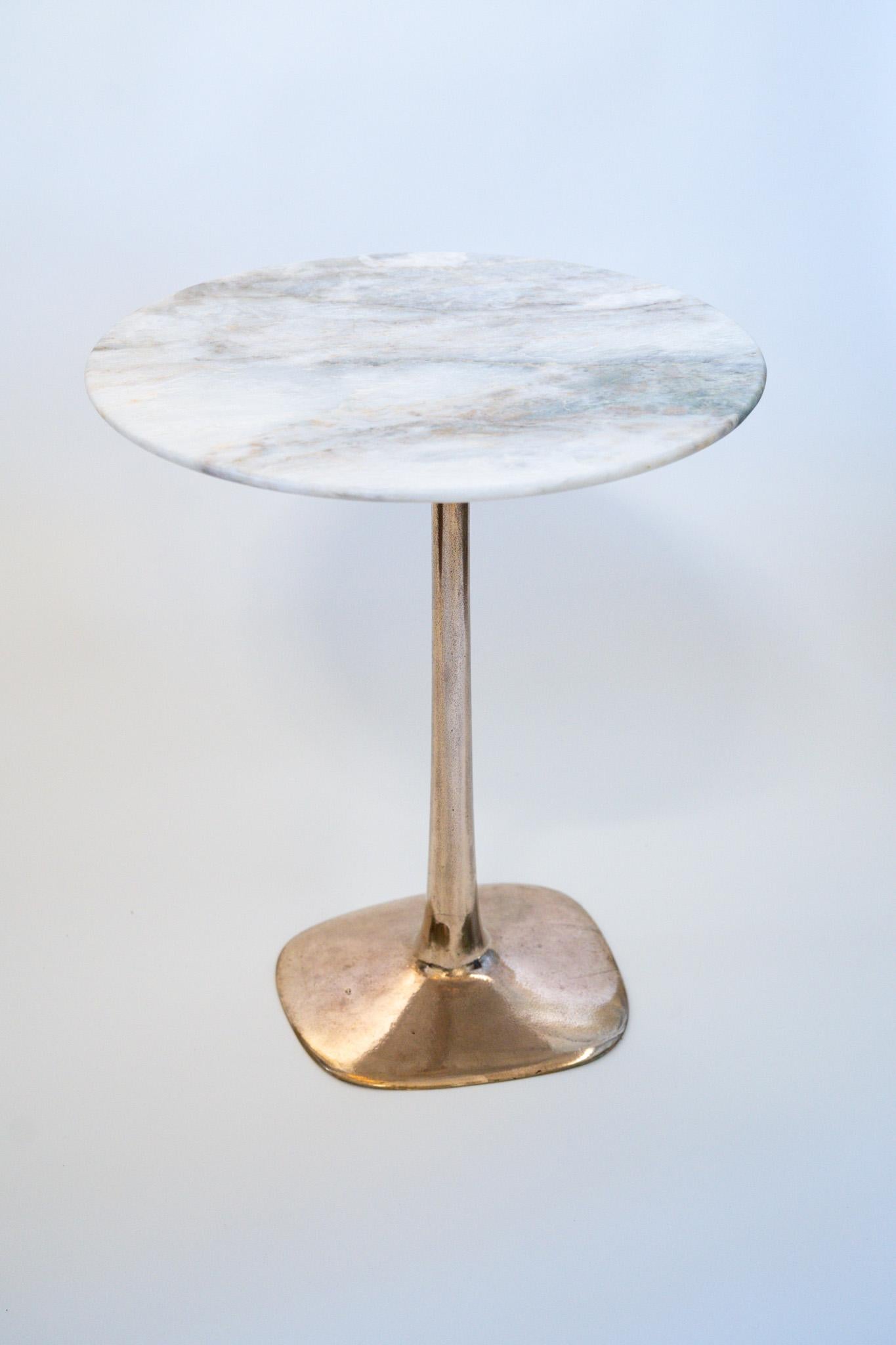 Designed by Daniel Barbera, this Molecule Side Table has a solid bronze base married to a natural Green Fantasy Marble top.     The base is cast bronze that has been polished to a lustrous finish while still retaining textures and details from the