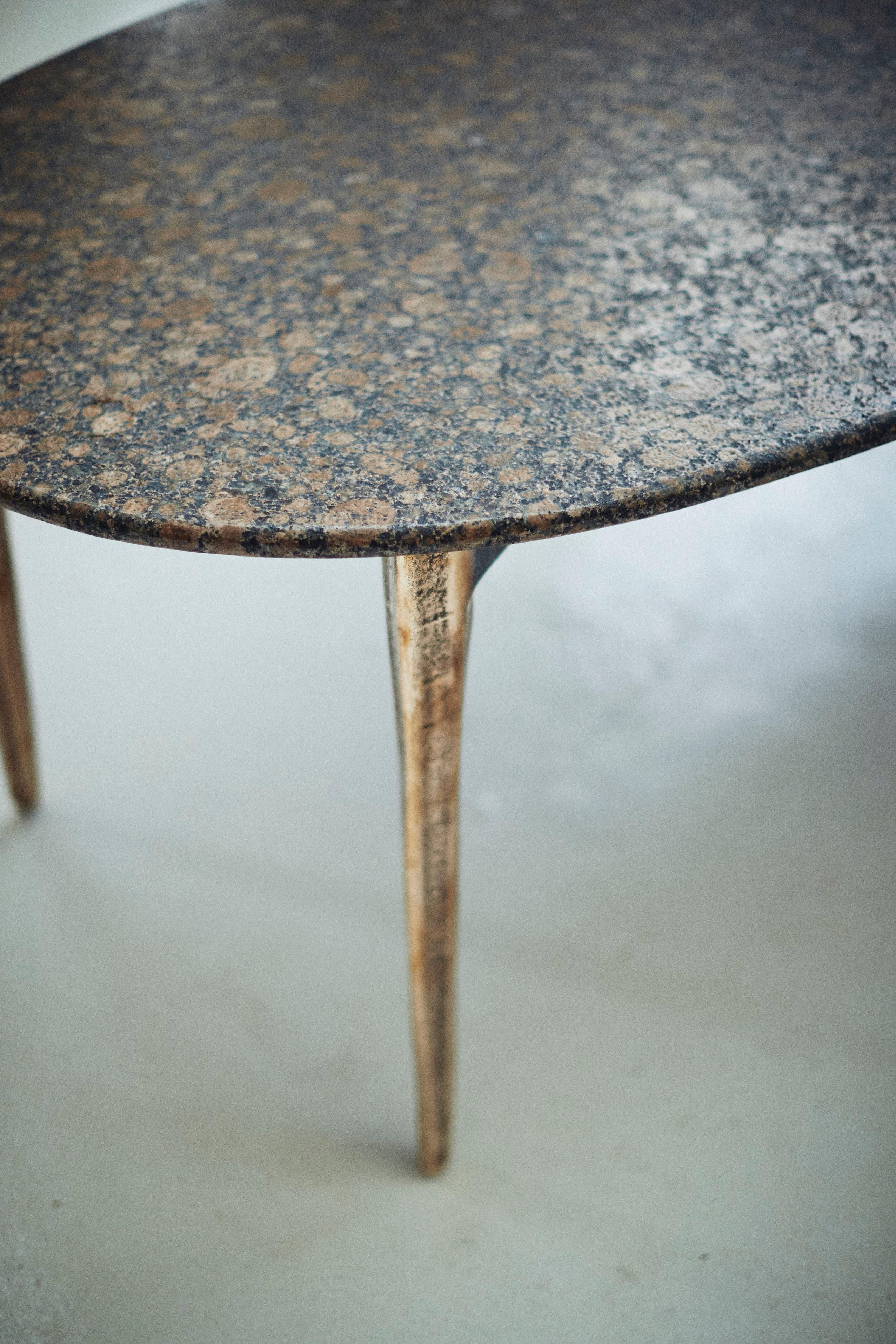 Designed by Daniel Barbera, the 'OSSO' oval table is a minimal yet organism life inspired form. The four-legged cast solid bronze base is rough cast and lightly worked to show the honesty of the process, but this can also be hand finished to a