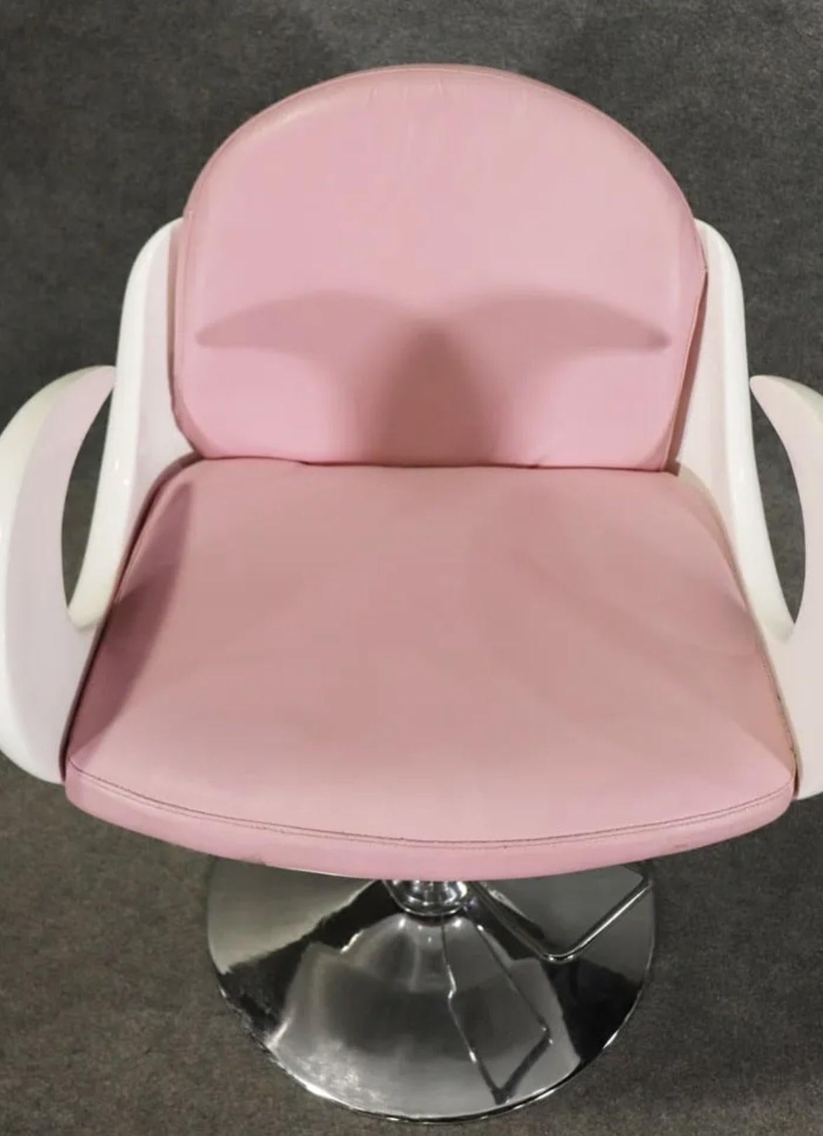 Rare barbershop chair by Carven with curled arms and pink seat.
Please confirm location NY or NJ