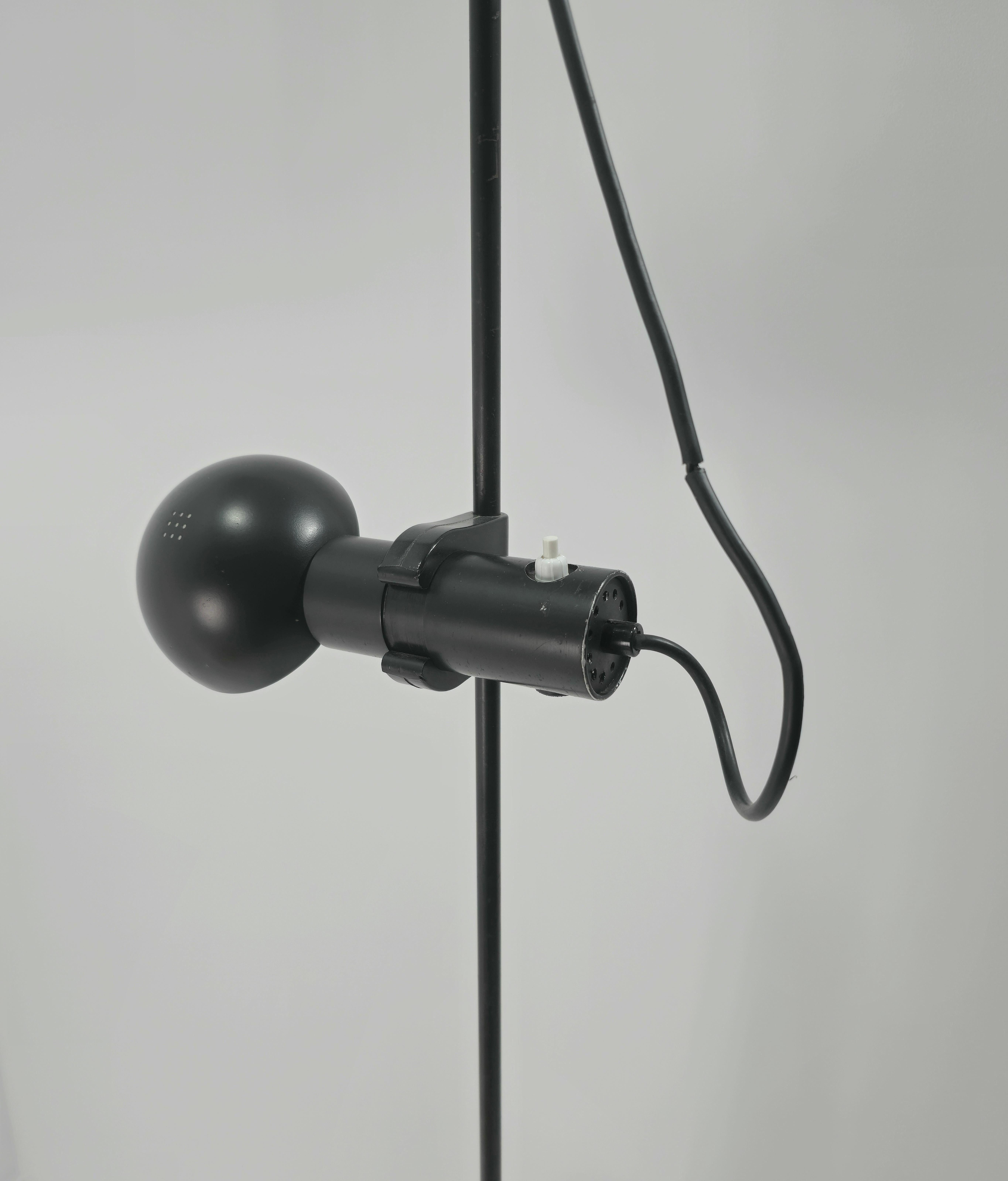 Floor lamp produced in Italy 1960/70s. Black painted metal structure. Adjustable height, adjustable hemispherical diffuser, circular cone base.They keep every part in original. Perfectly functional. Slim and elegant, it is what will make your home
