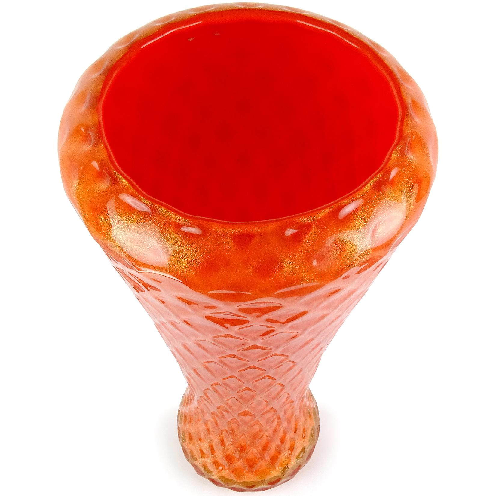 Beautiful large vintage Murano hand blown orange and gold flecks, diamond quilted surface Italian art glass flower vase. Attributed to designer Alfredo Barbini, circa 1950s. The vase is profusely covered in gold leaf throughout the surface. You can