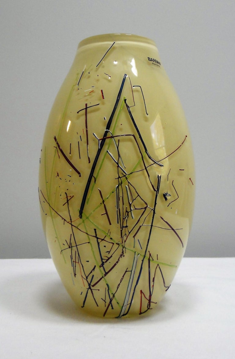 Barbini Murano art glass vase offered for sale is a large Barbini Murano art glass vase. The vase has glass stringer fused in a random pattern surrounding the circumference. Alfredo Barbini, a glass artist born in 1912 on the islands of Murano in