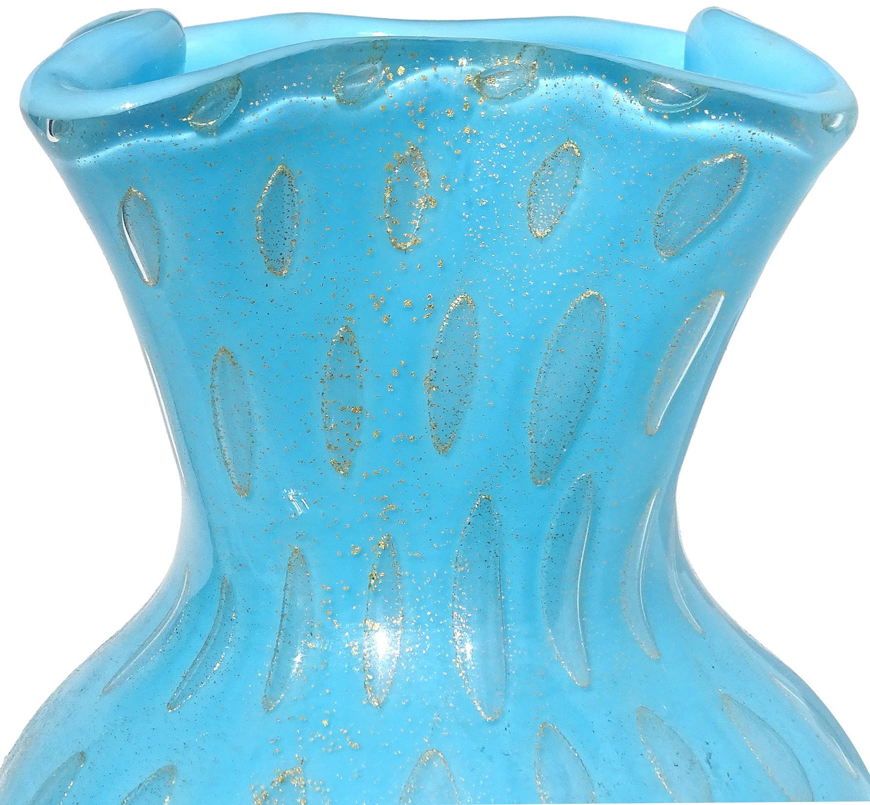 Beautiful vintage Murano hand blown blue gold flecks and controlled bubbles Italian art glass decorative flower vase. Documented to designer Alfredo Barbini, circa 1950-1960. The vase has a rectangular rim, with pinched decorative folds and round