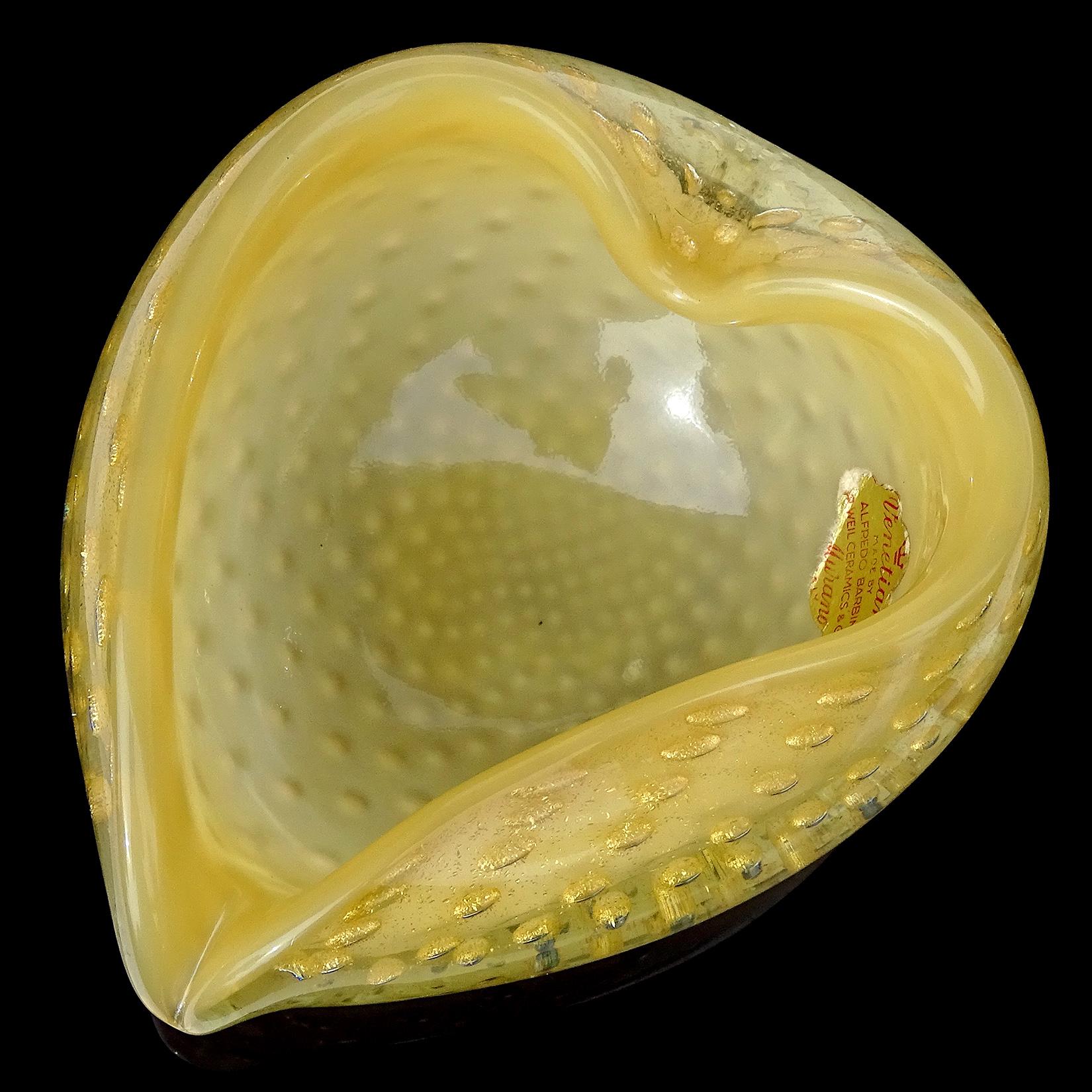 Beautiful Murano hand blown opal caramel yellow and gold flecks Italian art glass heart shaped bowl. Documented to master glass artist and designer Alfredo Barbini. The bowl has an original 