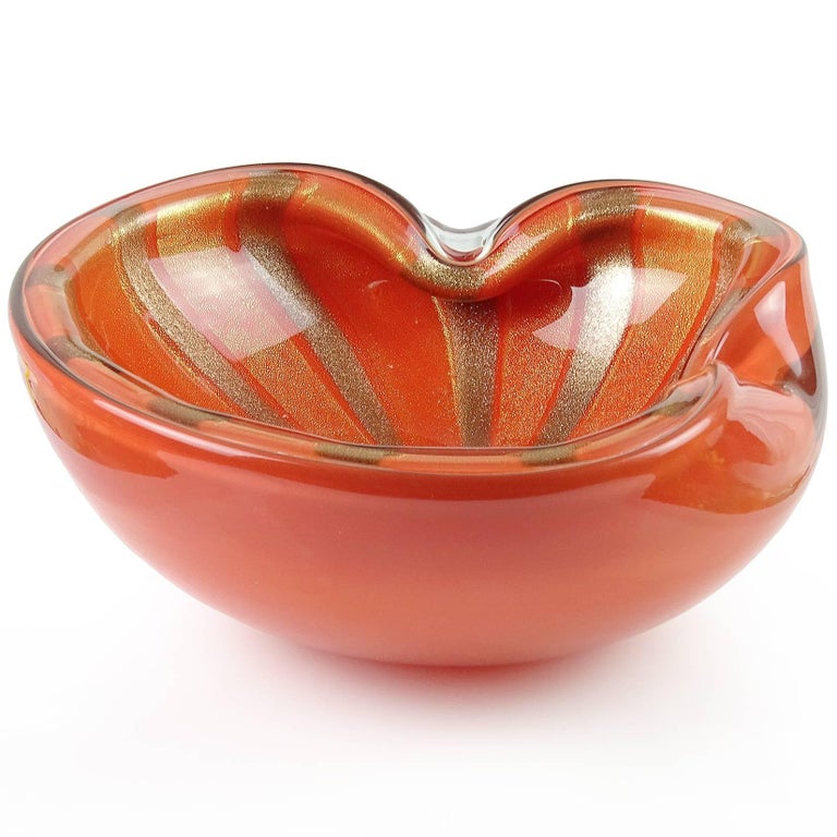 Gorgeous large vintage Murano hand blown persimmon orange, gold and aventurine flecks Italian art glass bowl. Documented to designer Alfredo Barbini, circa 1950-1960. Glitters in any light. Rare color for this design. Can be used as a display piece