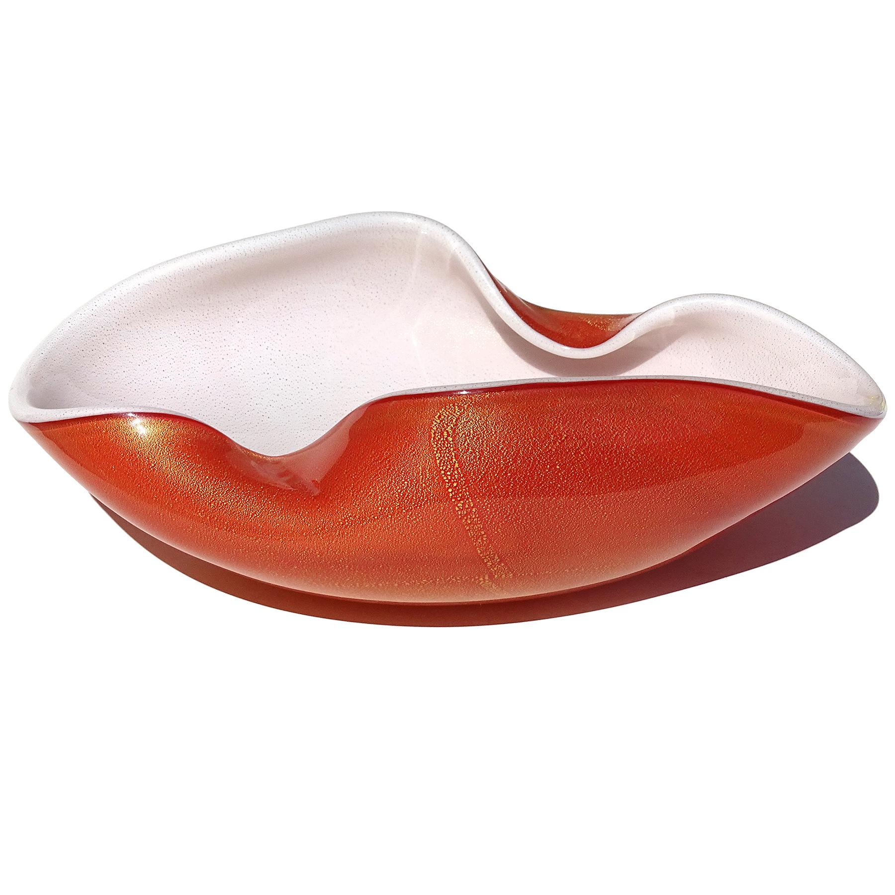 Beautiful and large vintage Murano hand blown orange over white, and gold flecks Italian art glass decorative bowl / centerpiece. Documented to Master glass artist and designer Alfredo Barbini, circa 1950-1960. Similar ones are published in his