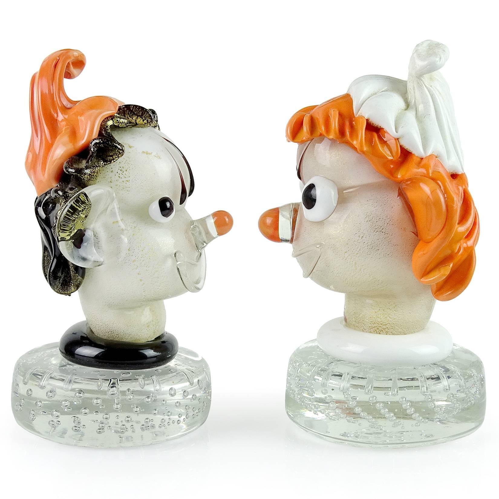 Priced per item (2 different designs available). Beautiful and cute vintage Murano hand blown orange, black, white and gold flecks Italian art glass elf head paperweights. Documented to designer Alfredo Barbini. Very expressive little guys, with